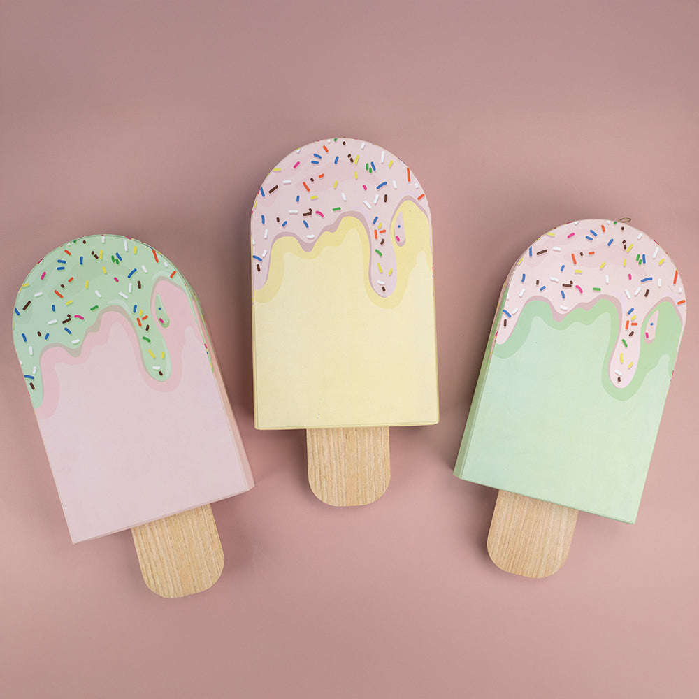 Pastel popsicle-themed baby shower return favour with cocktail kit and sprinkles. Ask ChatGPT