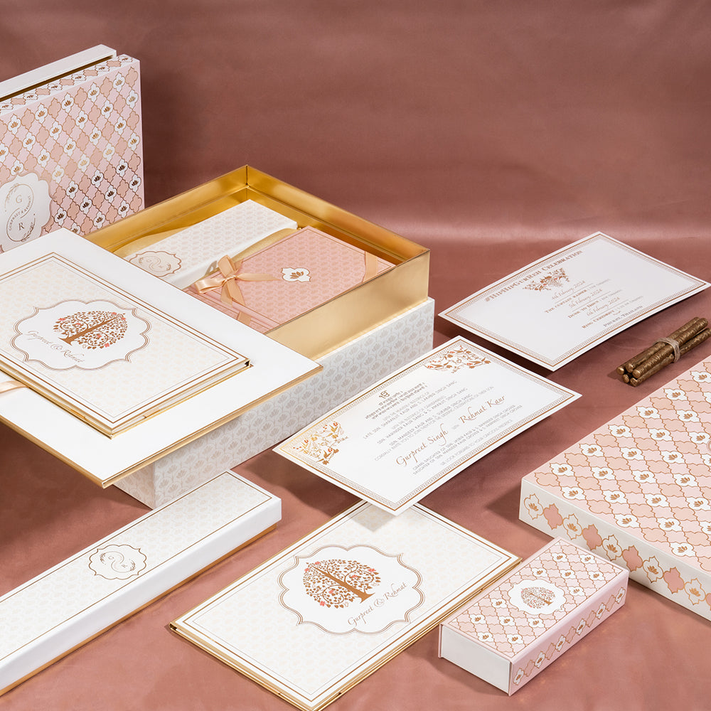 Elegant pastel wedding invitation box set with rose gold details, royal motifs, and personalized inserts