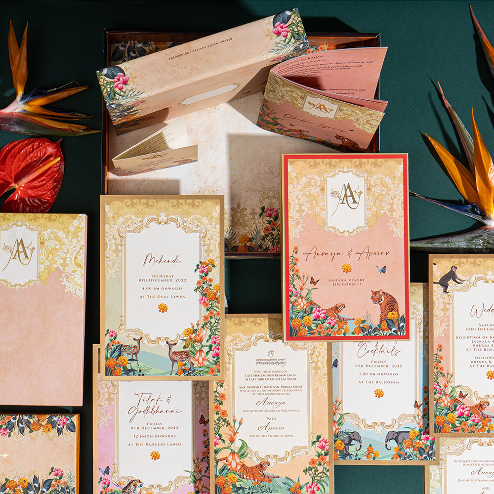 Illustrated wedding invitation set with wild animal motifs and colorful floral borders