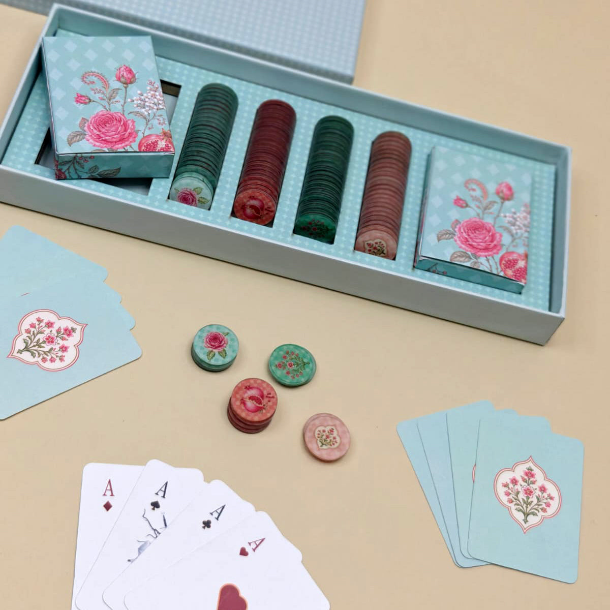 Premium playing card and poker chip gift set in floral packaging