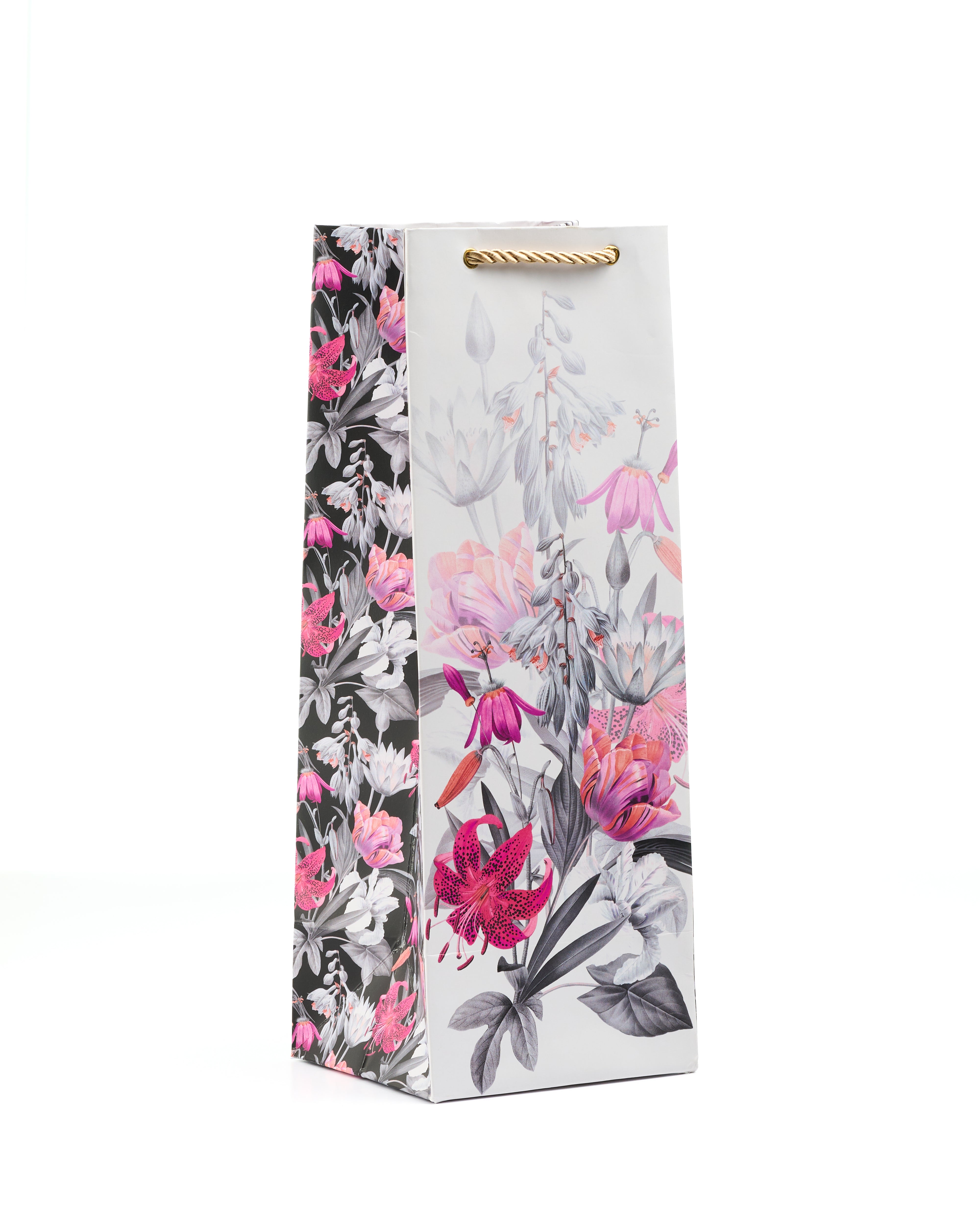 Tall floral wine gift bag featuring pink and grey botanical artwork with gold rope handles.