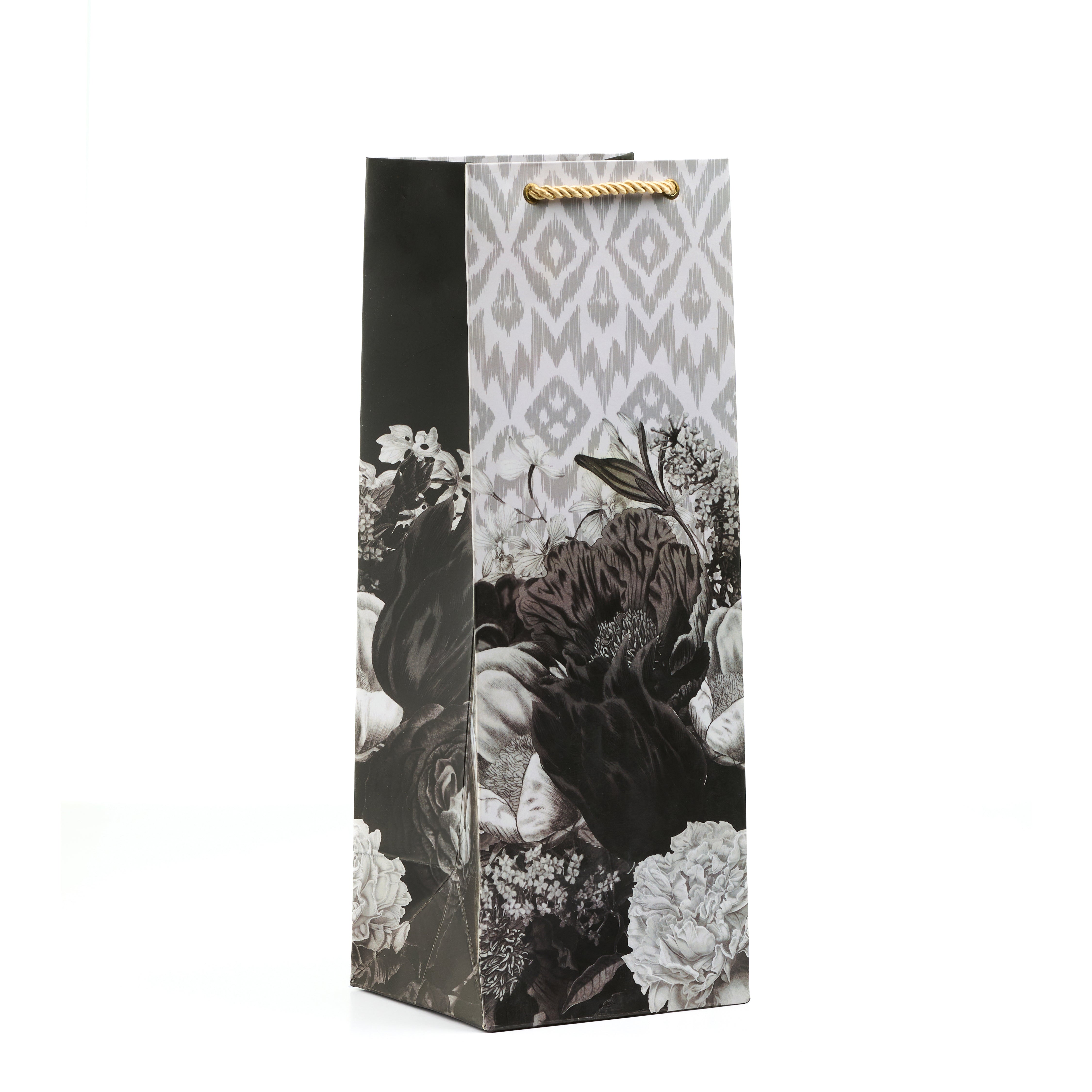 Tall wine gift bag with dark floral artwork and ikat print sides, perfect for classy bottle gifting.