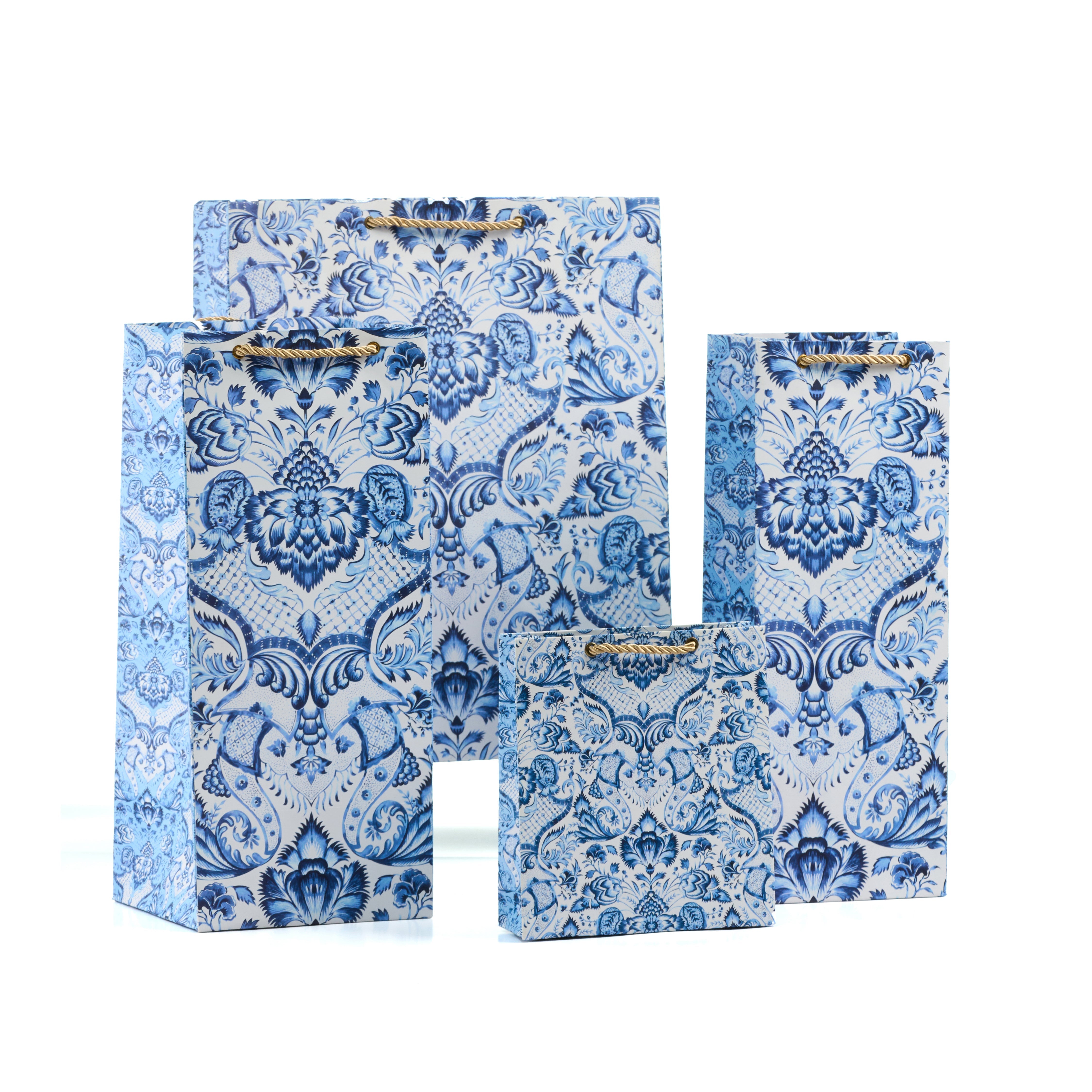 Blue Batik Grande gift bag set featuring shirt, medium, small, and wine bags in a luxe floral blue and white design.