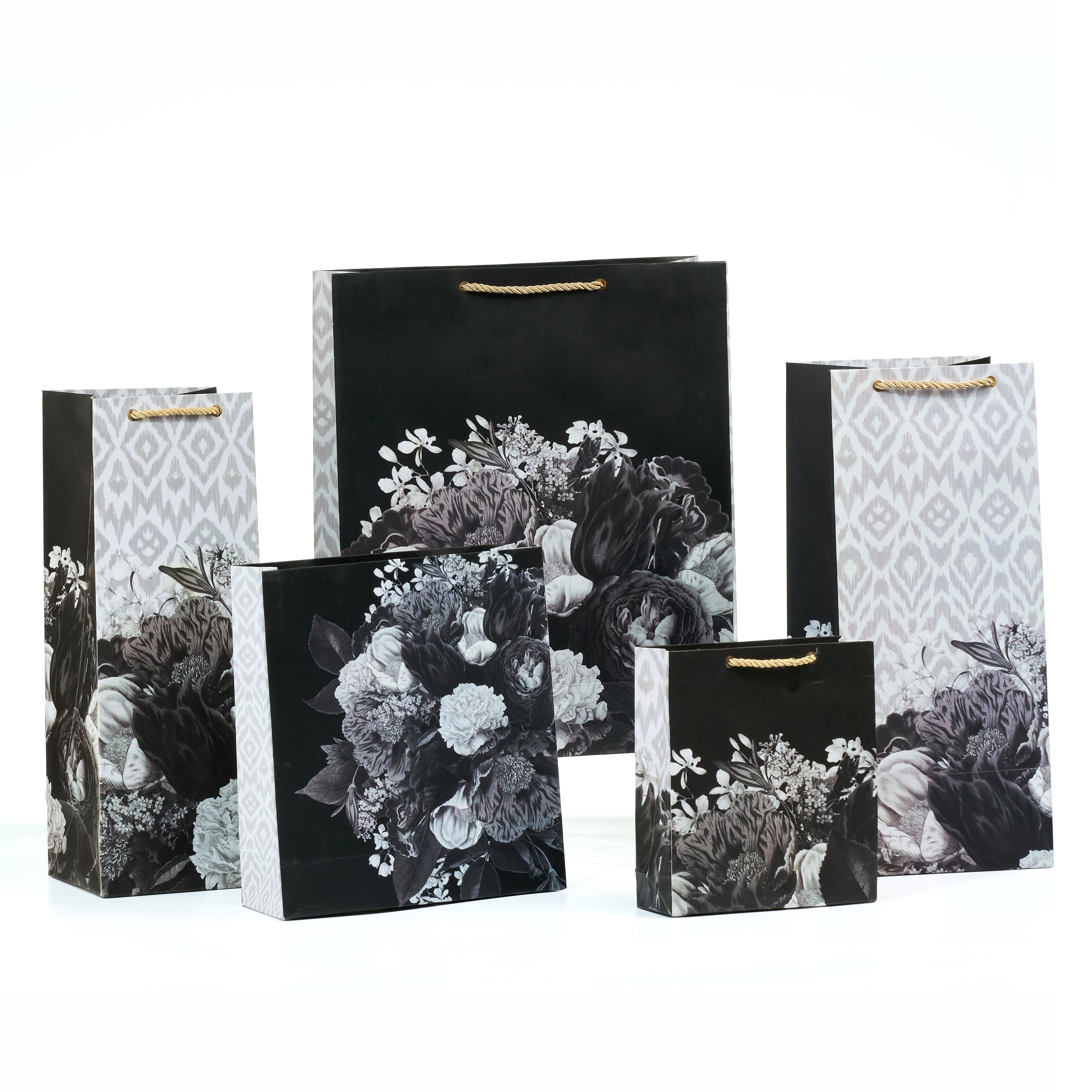 Grande gift bag set with shirt, medium, small, and wine bags in a black floral and ikat design, ideal for luxe gifting.
