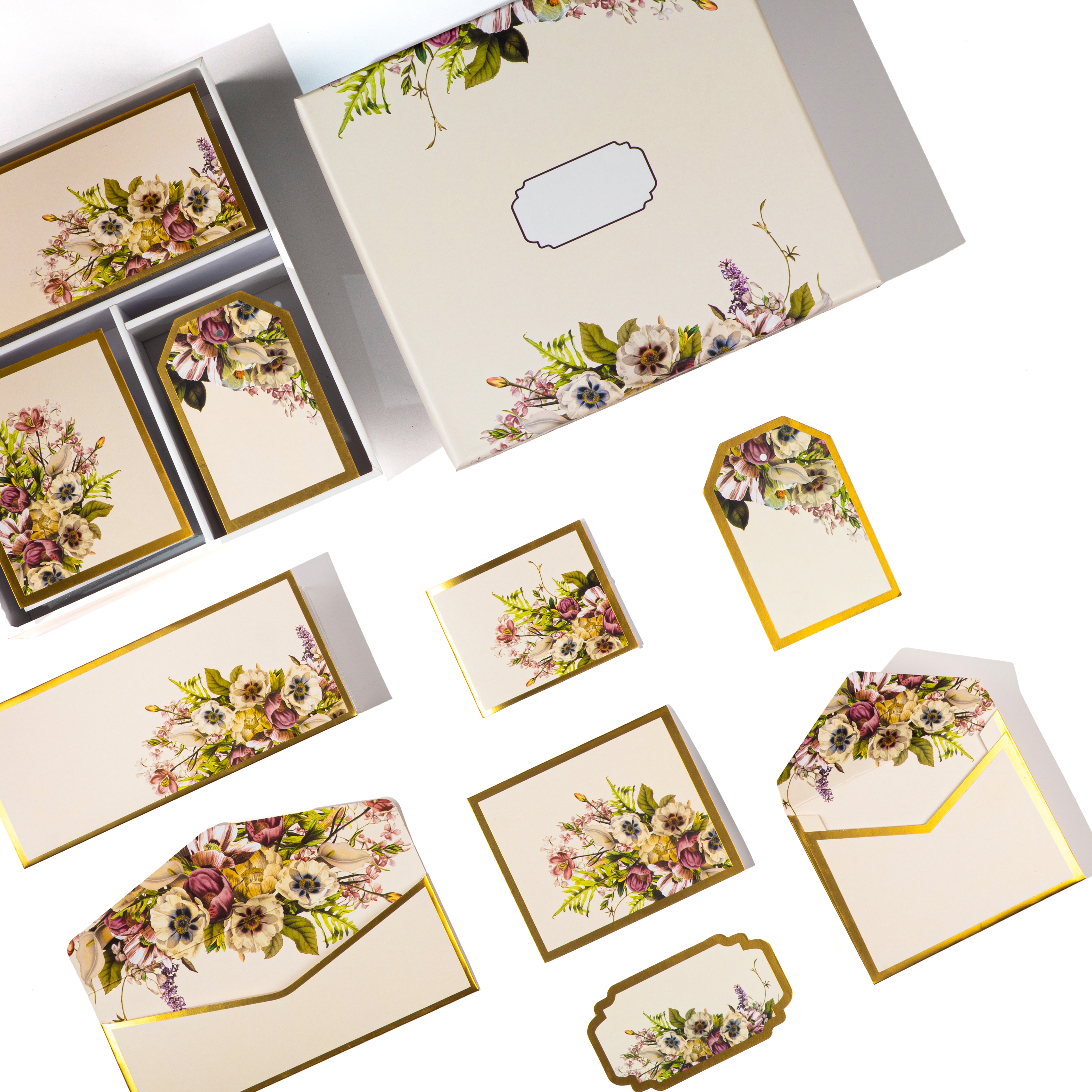 Cream boxed stationery with elegant floral bouquets on cards, tags, and envelopes.