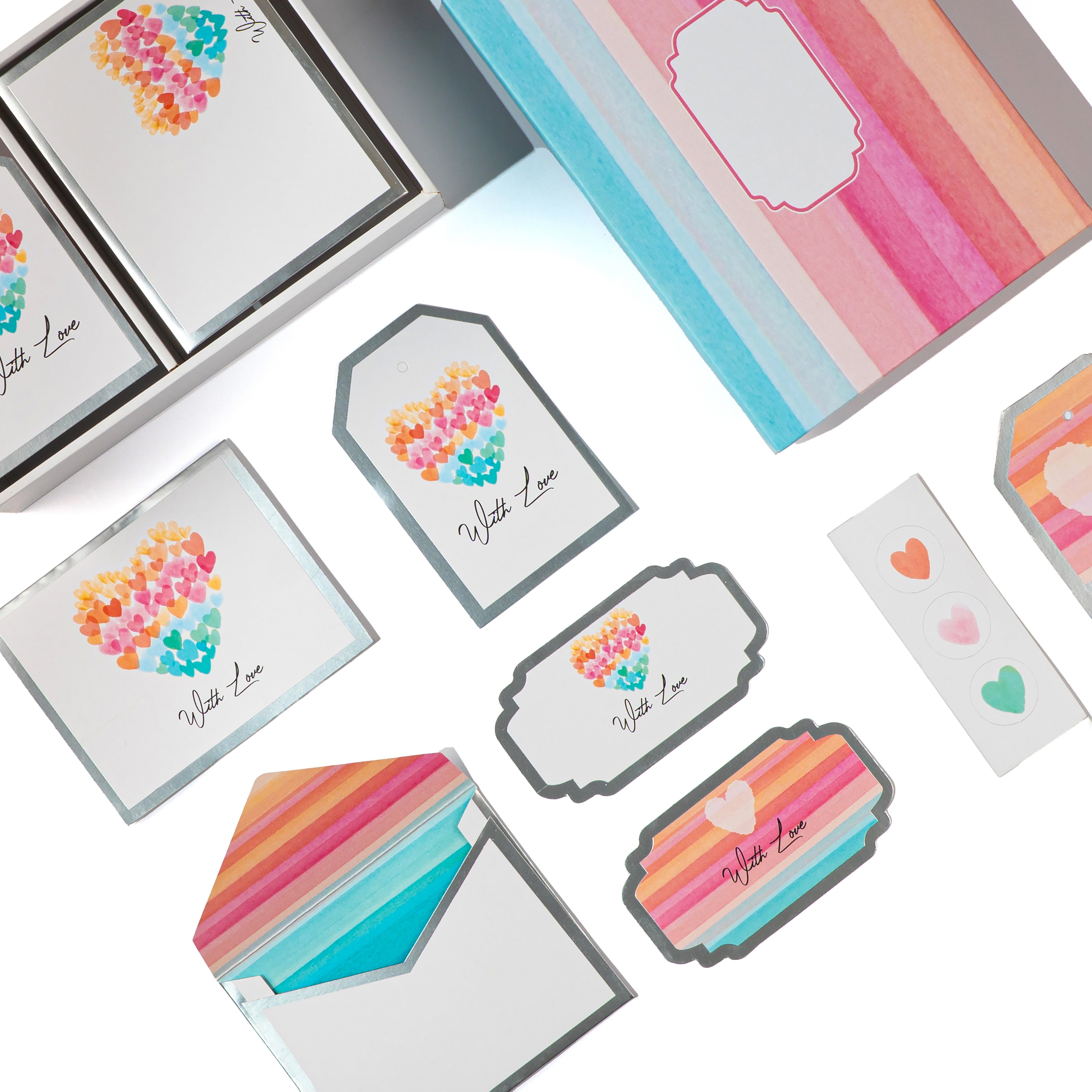 Vibrant striped stationery box featuring watercolor heart motifs and “With Love” tags.