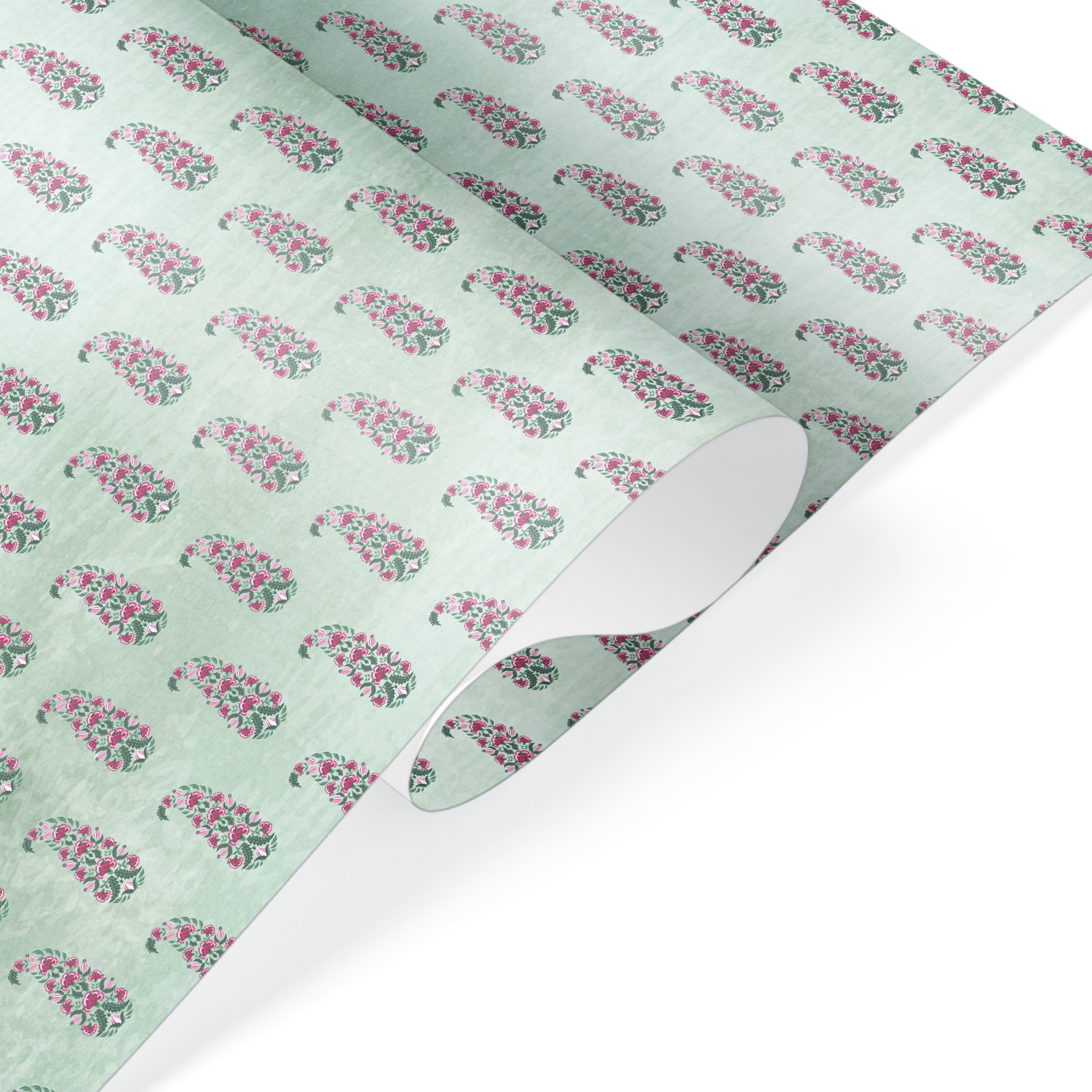 Wrapping paper with repeated pink floral paisley motifs on a soft mint green textured background.