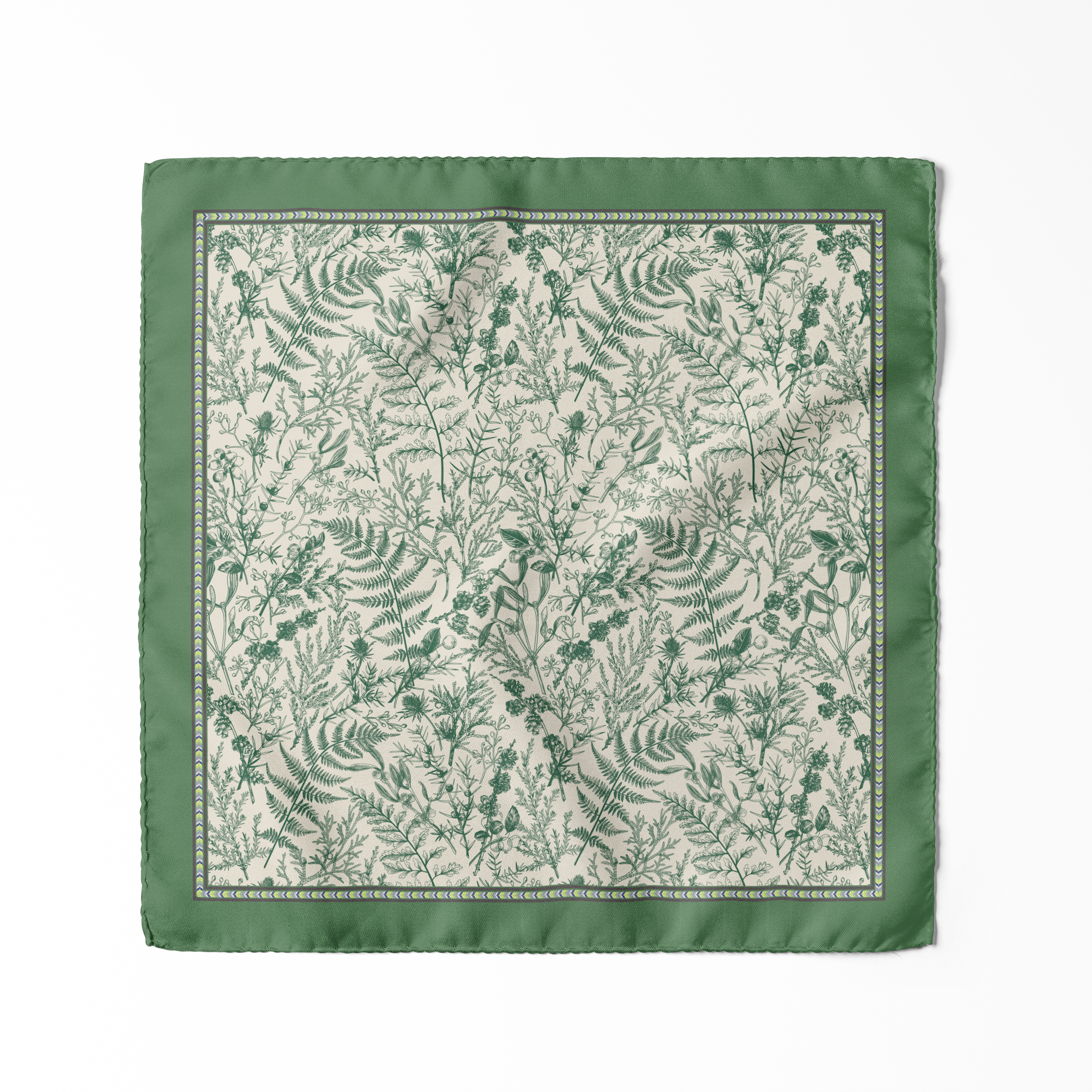 Deep green pocket square with intricate botanical foliage motifs on an ivory centre