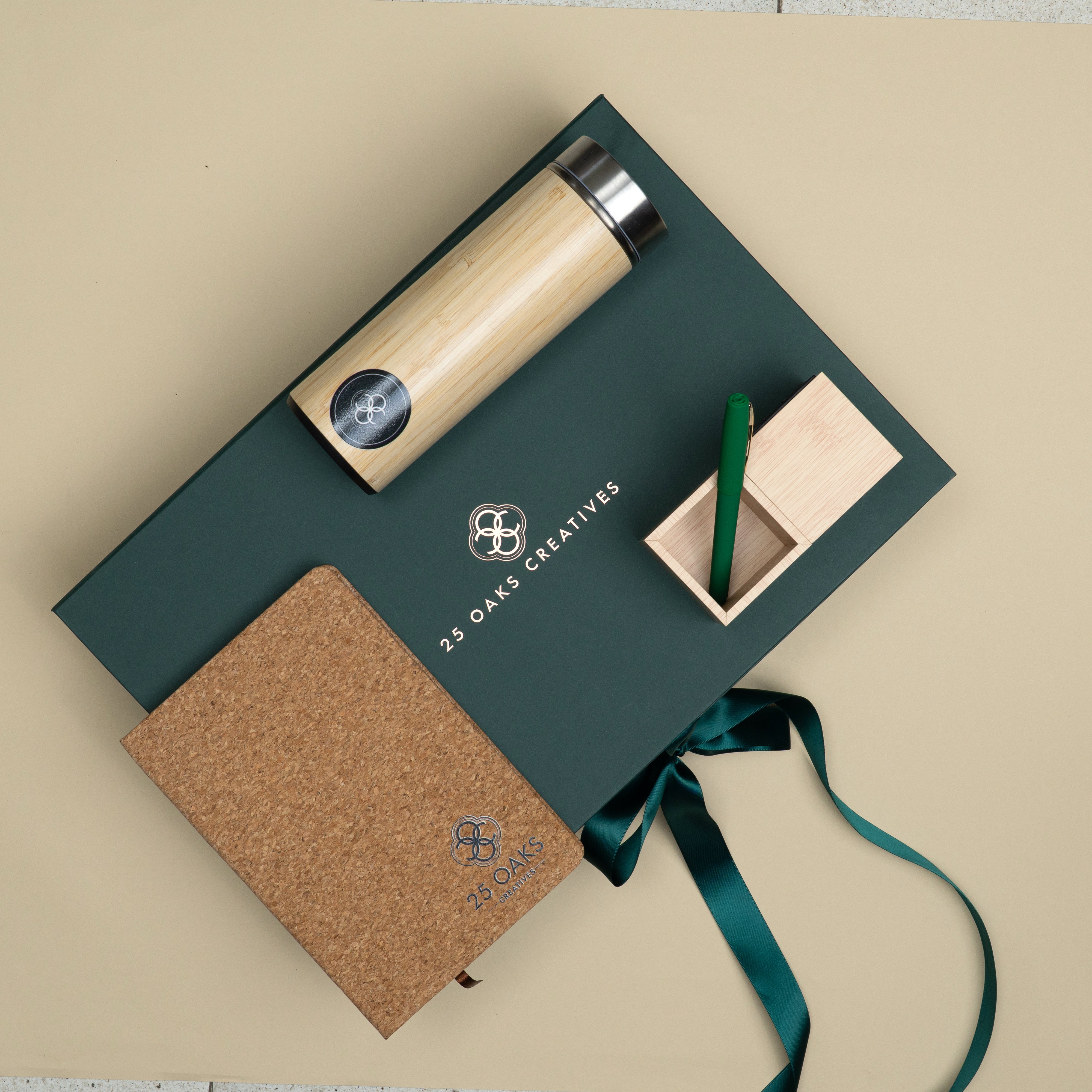 The Green Desk corporate gifting set with cork diary, green pen, bamboo clock and bamboo bottle packed in a premium customized gift box.