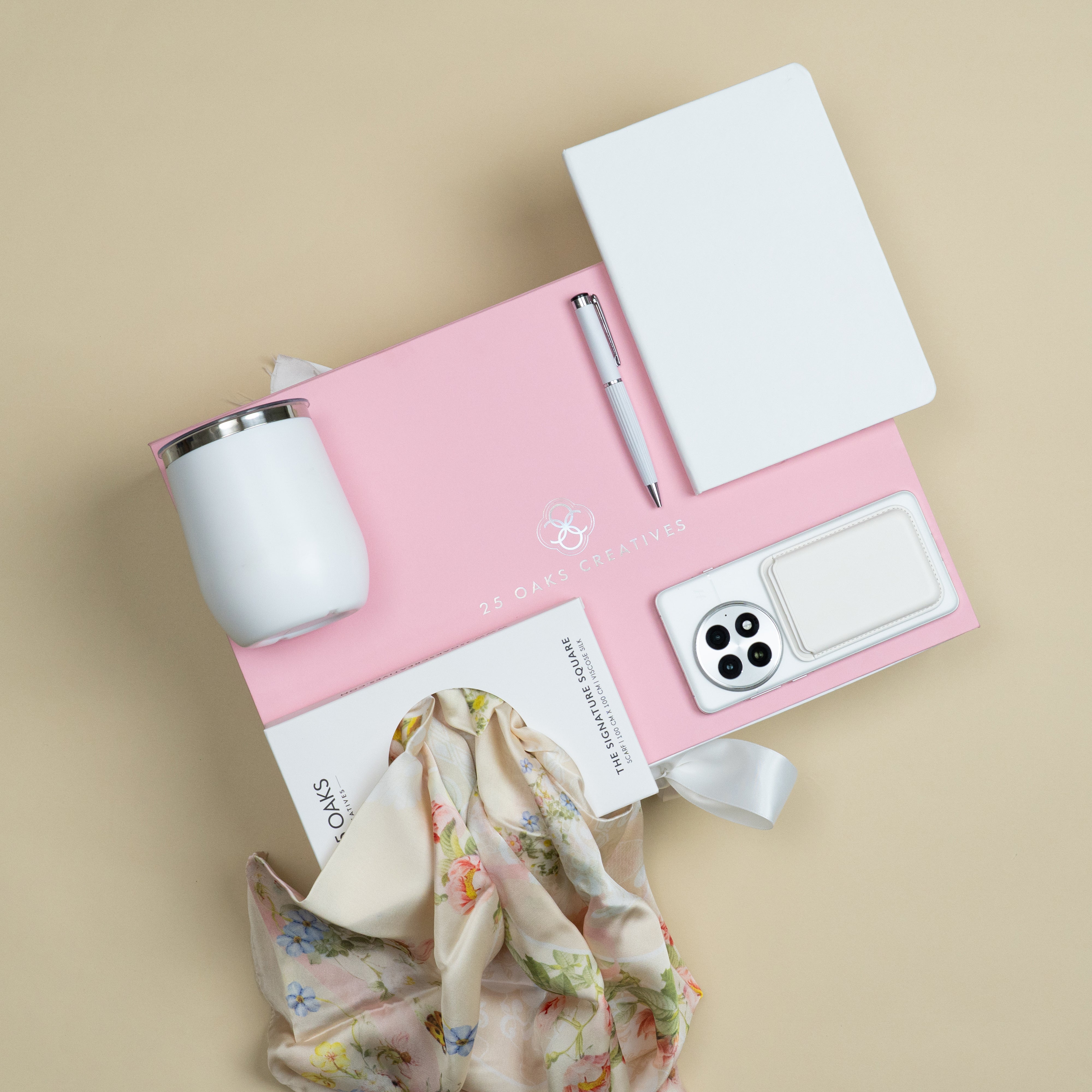 Elegant customized corporate gift hamper featuring a white flask, diary, scarf, MagSafe card holder and pen.