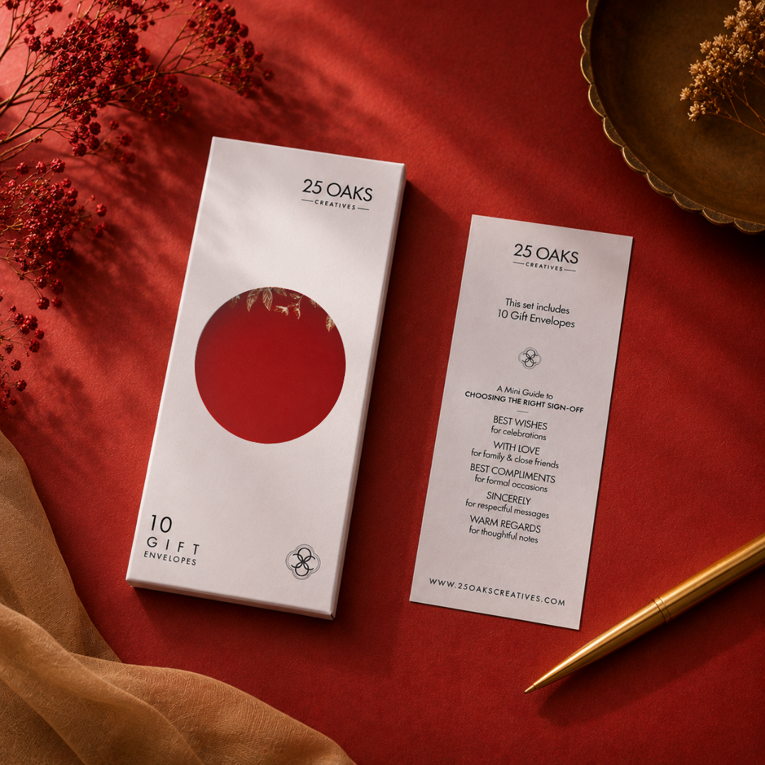 Elegant crimson gifting envelope with gold foil border and delicate botanical design in a white box.