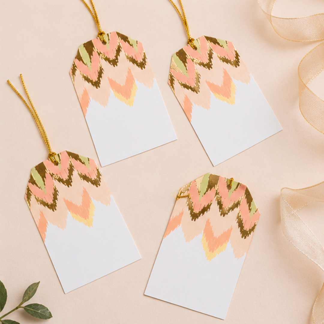 Sophisticated peach and blush hanging tags displayed with matching gift bags and neutral textures for premium gifting inspiration.