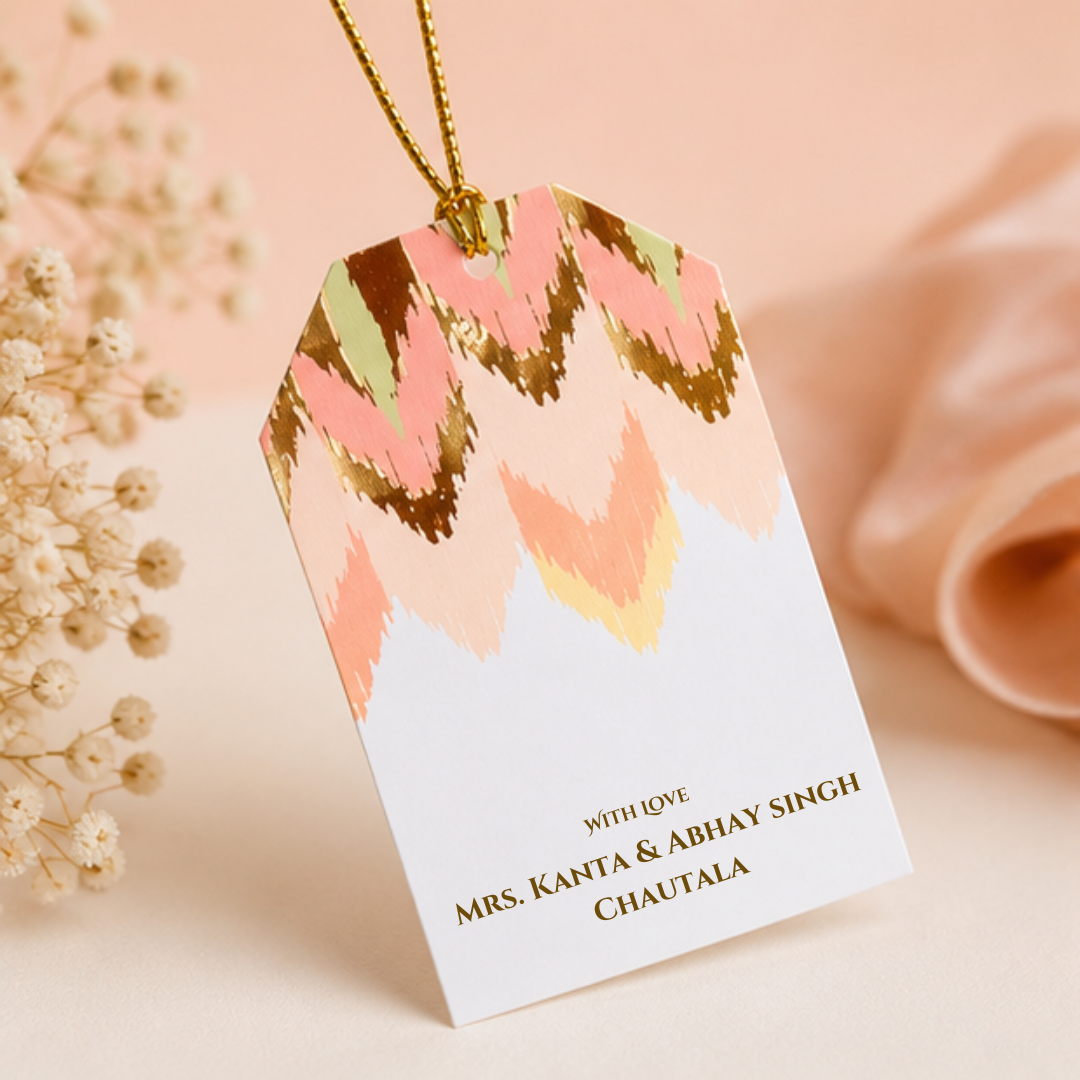 Elegant pastel hanging gift tags with abstract chevron artwork and golden dori, styled in a soft luxury product photoshoot.