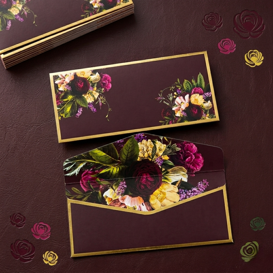 Deep blue and maroon money envelopes with floral artwork and gold accents—ideal for wedding gifts, shagun, and festive celebrations.