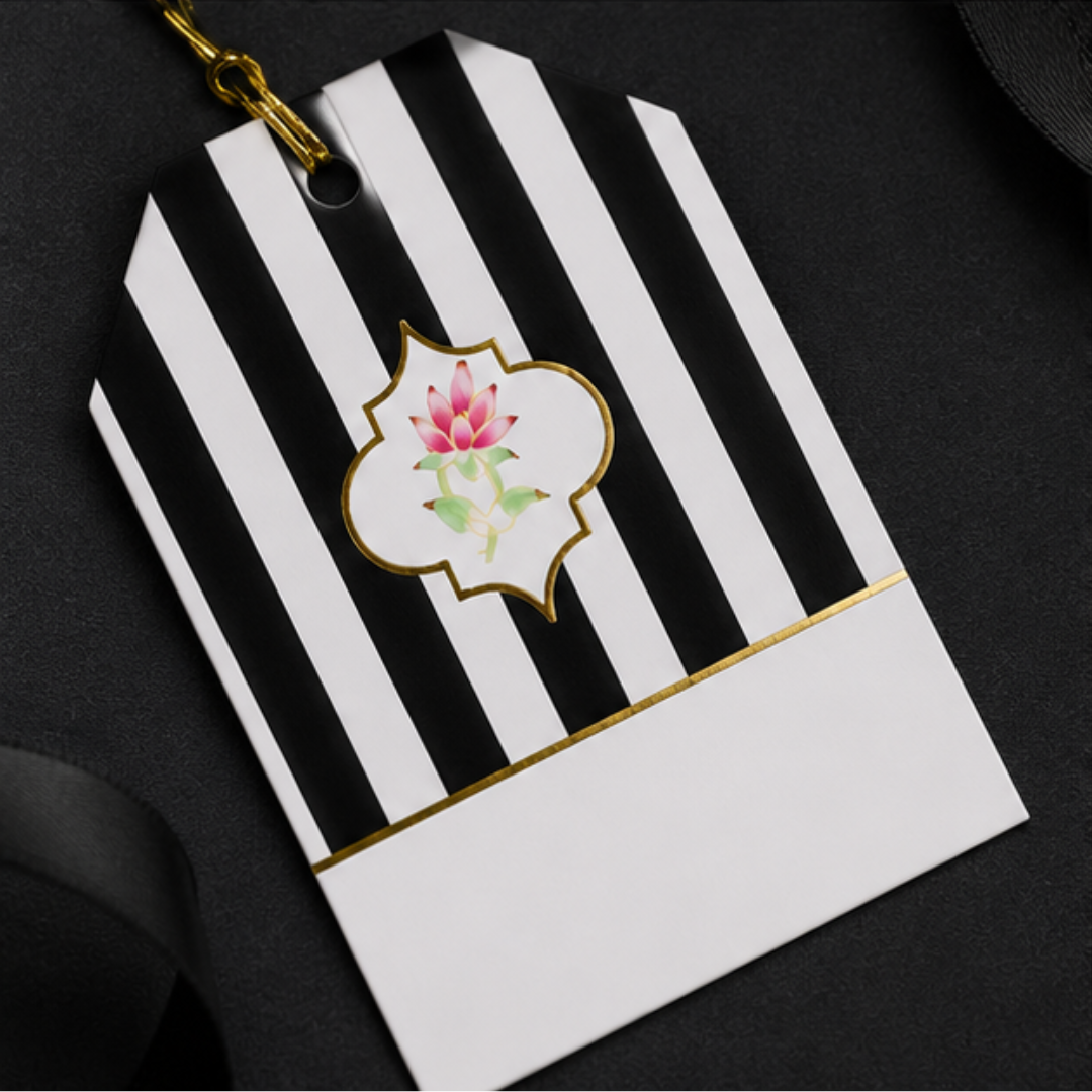 Sophisticated monochrome hanging tags displayed with black gift bags and premium props for refined gifting inspiration.