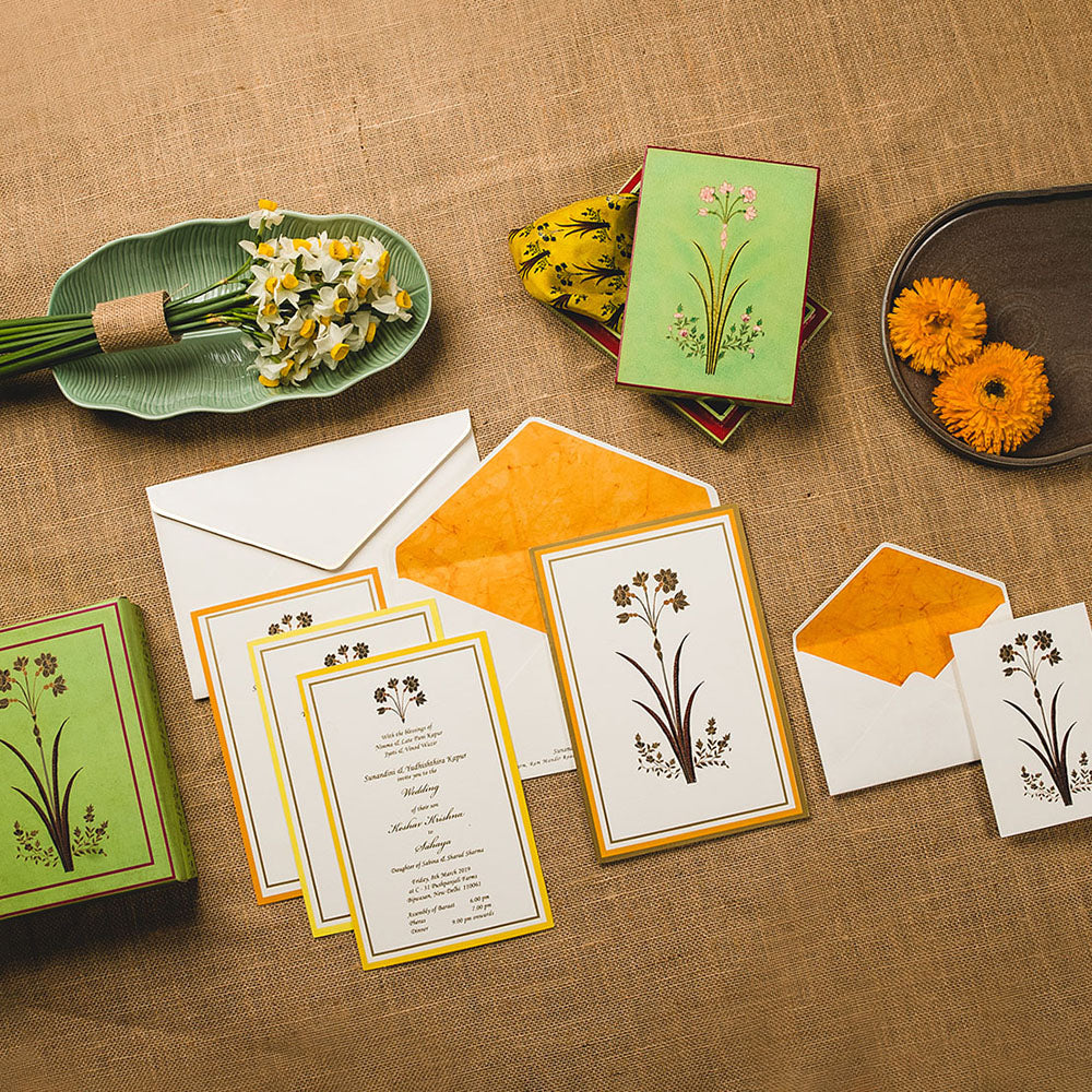 Luxury Kashmiri-inspired wedding invitation suite with hand-painted florals and custom papier-mâché gift box