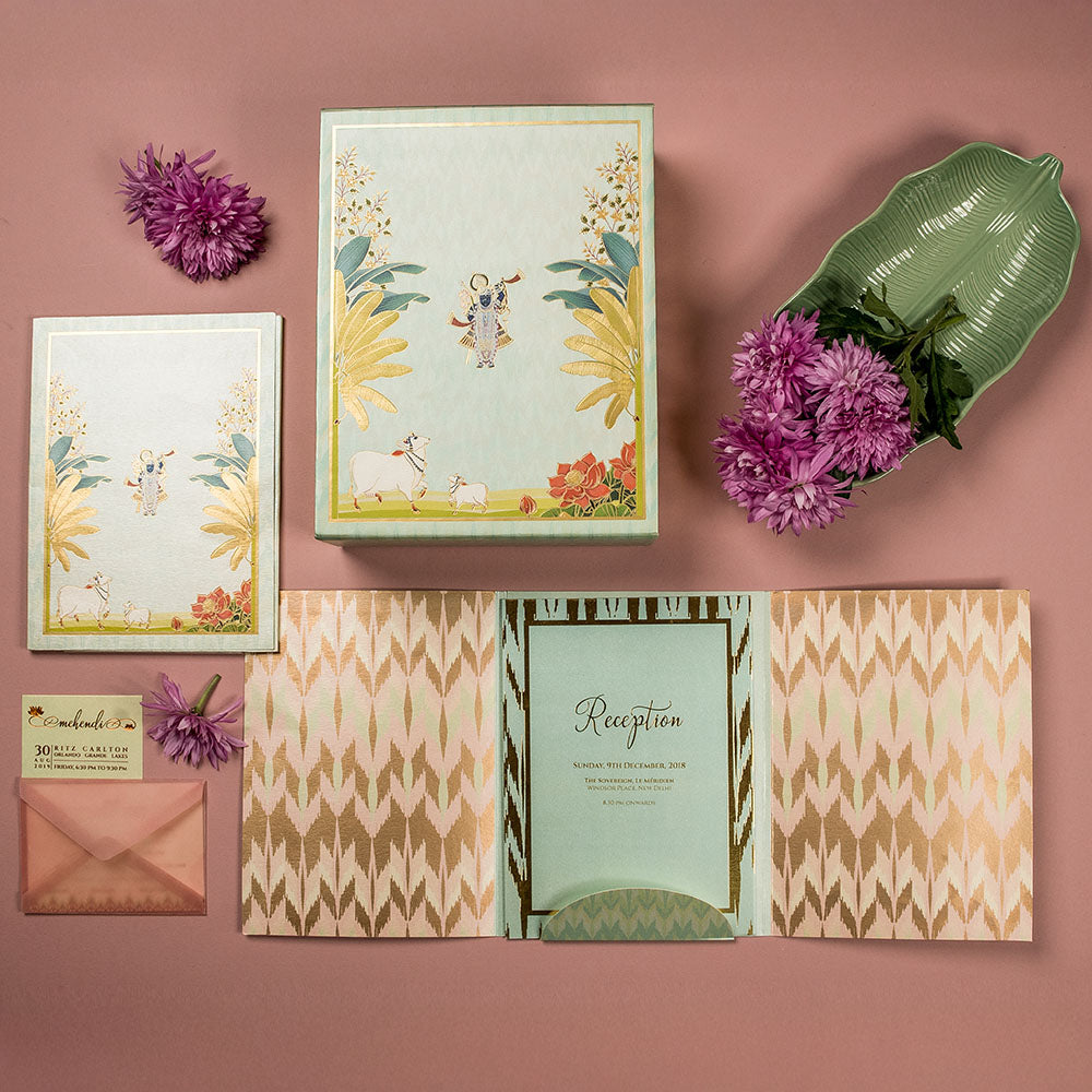 Blush pink Banarasi wedding box with Krishna and cow illustrations