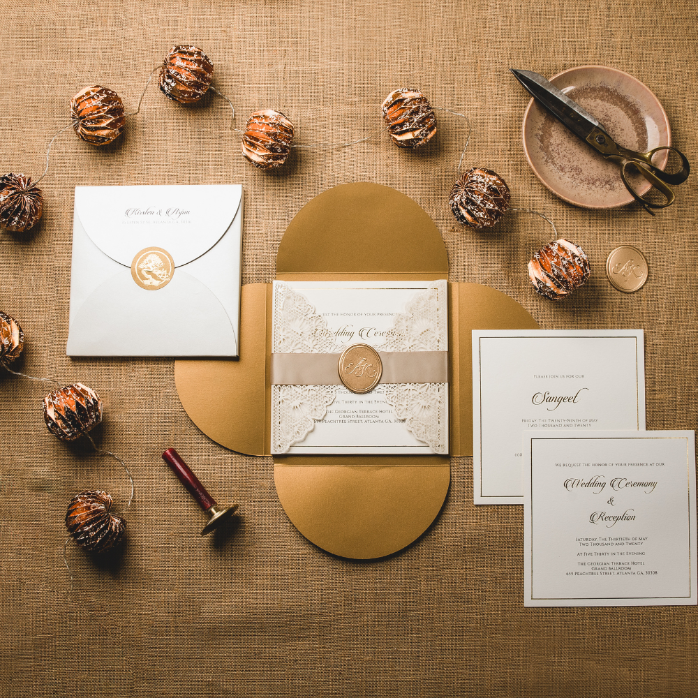 Golden invitation suite with lace wrap and wax seal