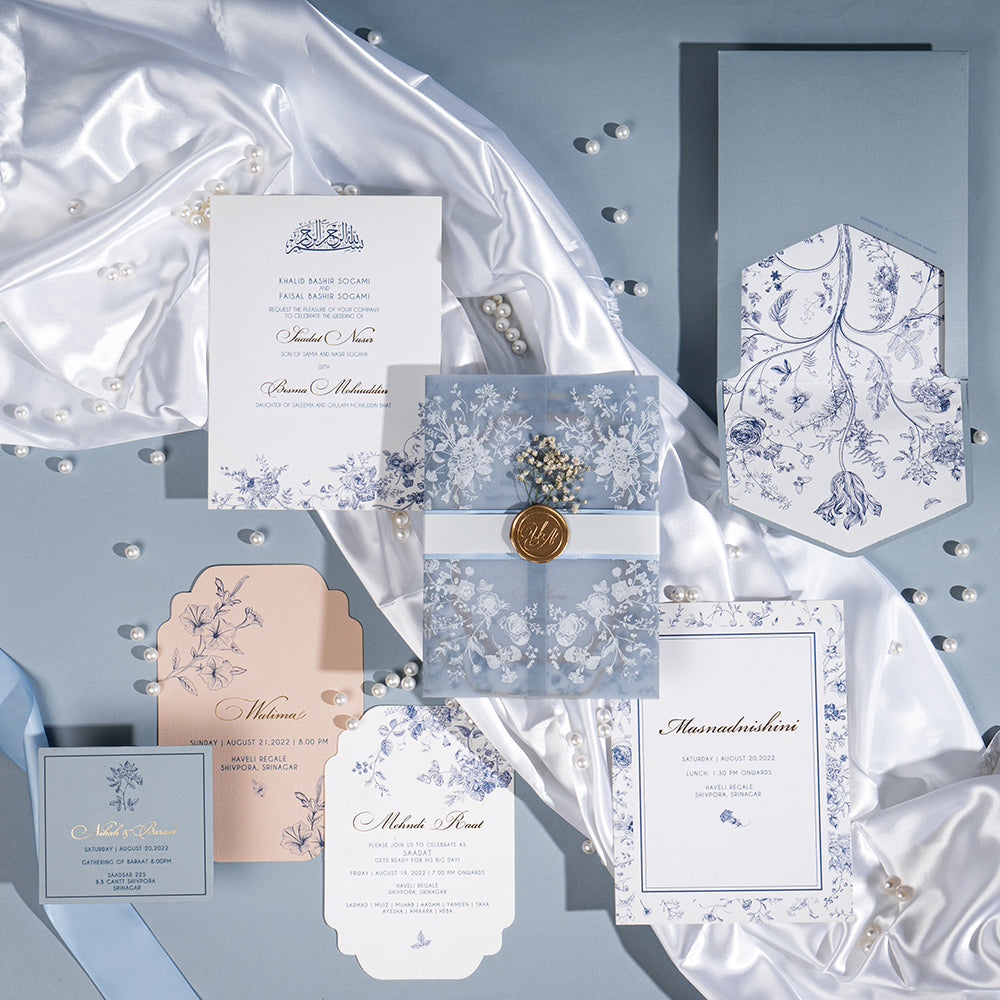 Elegant Kashmiri wedding invite with Chinar leaves, pearl accents and wax seal