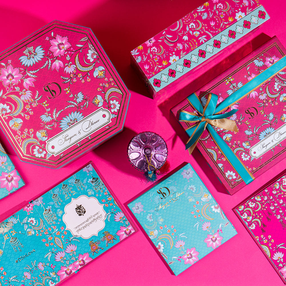 Vibrant Phool Bazaar themed wedding invite with desi celebration elements