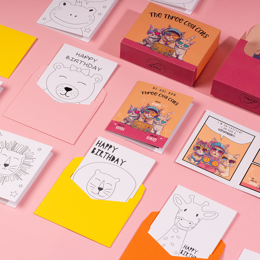 Comic-style baby announcement box with funky cat design, personalised colouring cards and stationery for kids