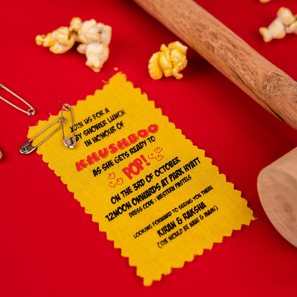 Popcorn baby reveal box with balloons, chocolate domes, and hidden sonogram surprise.