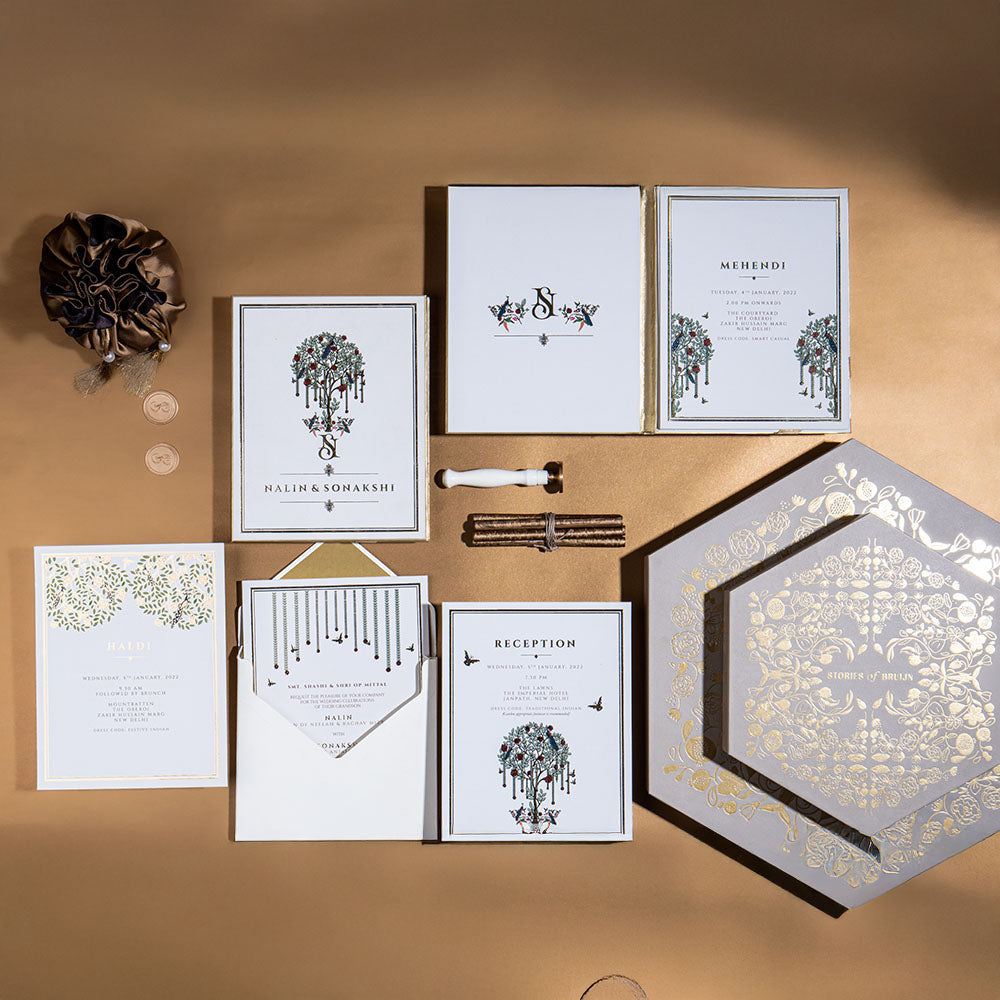 Ivory and gold Tree of Life wedding invite with hand-drawn foliage and peacocks