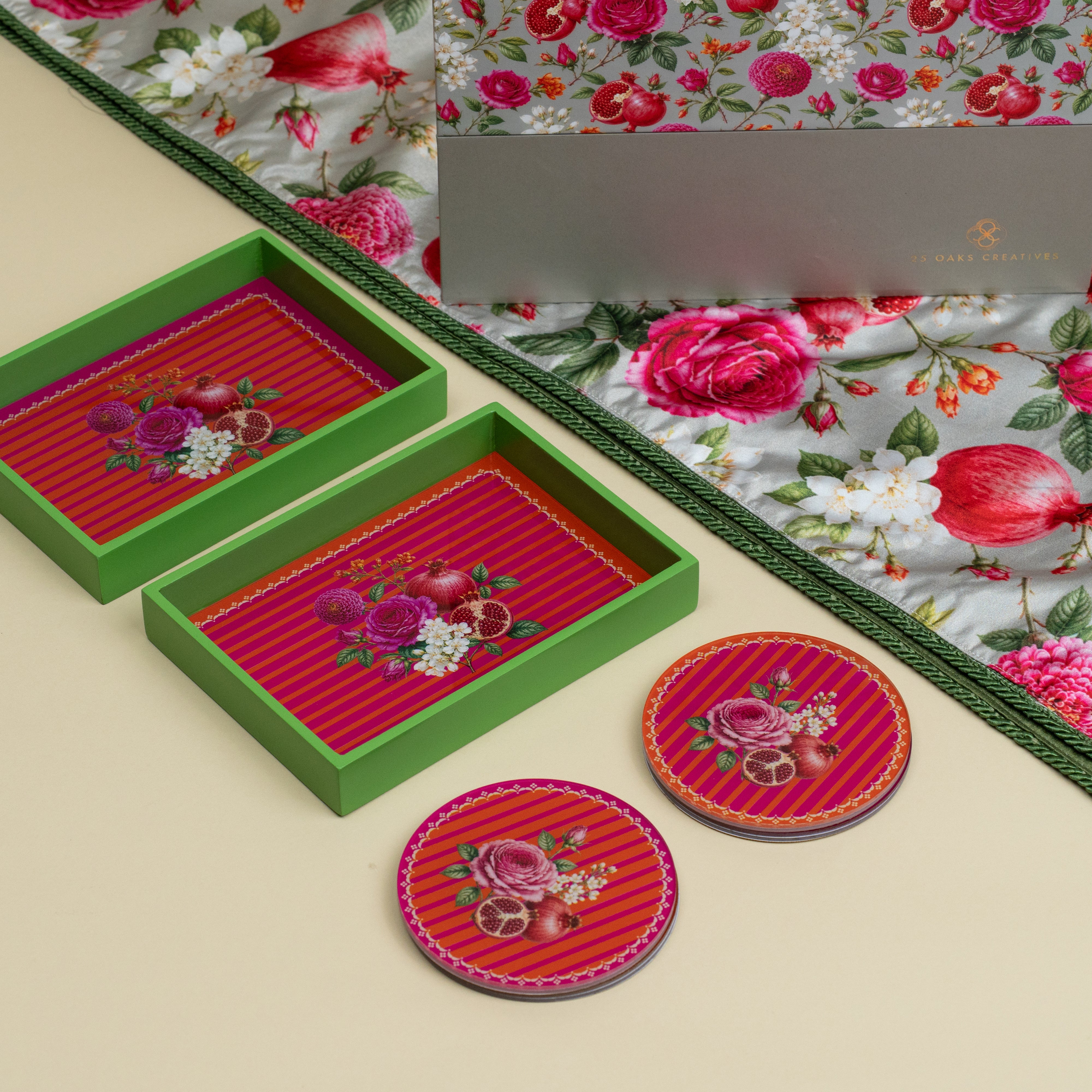 Festive floral table runner with mini serving trays and coasters