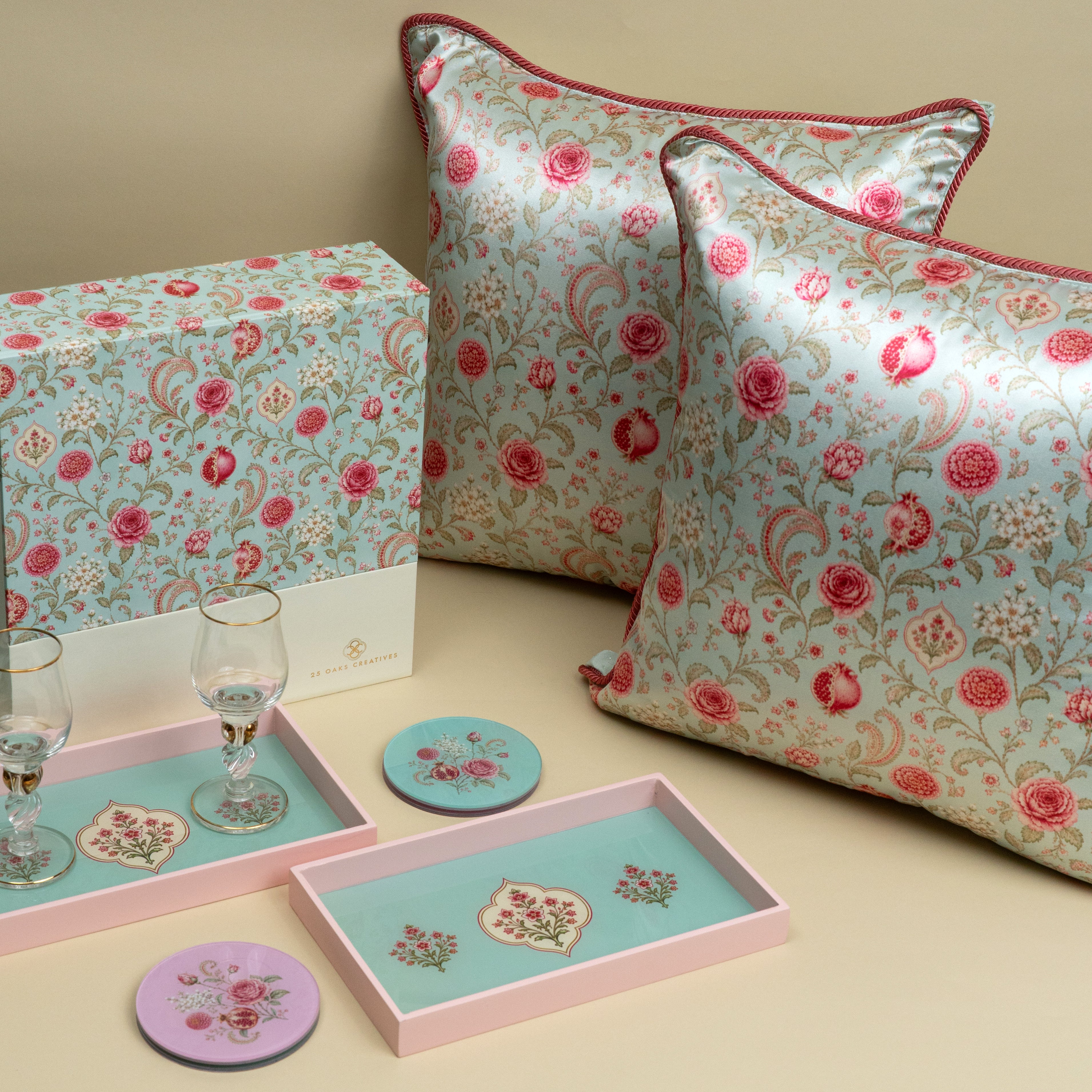 The Welcome festive home gifting set with floral cushion covers, trays and coasters