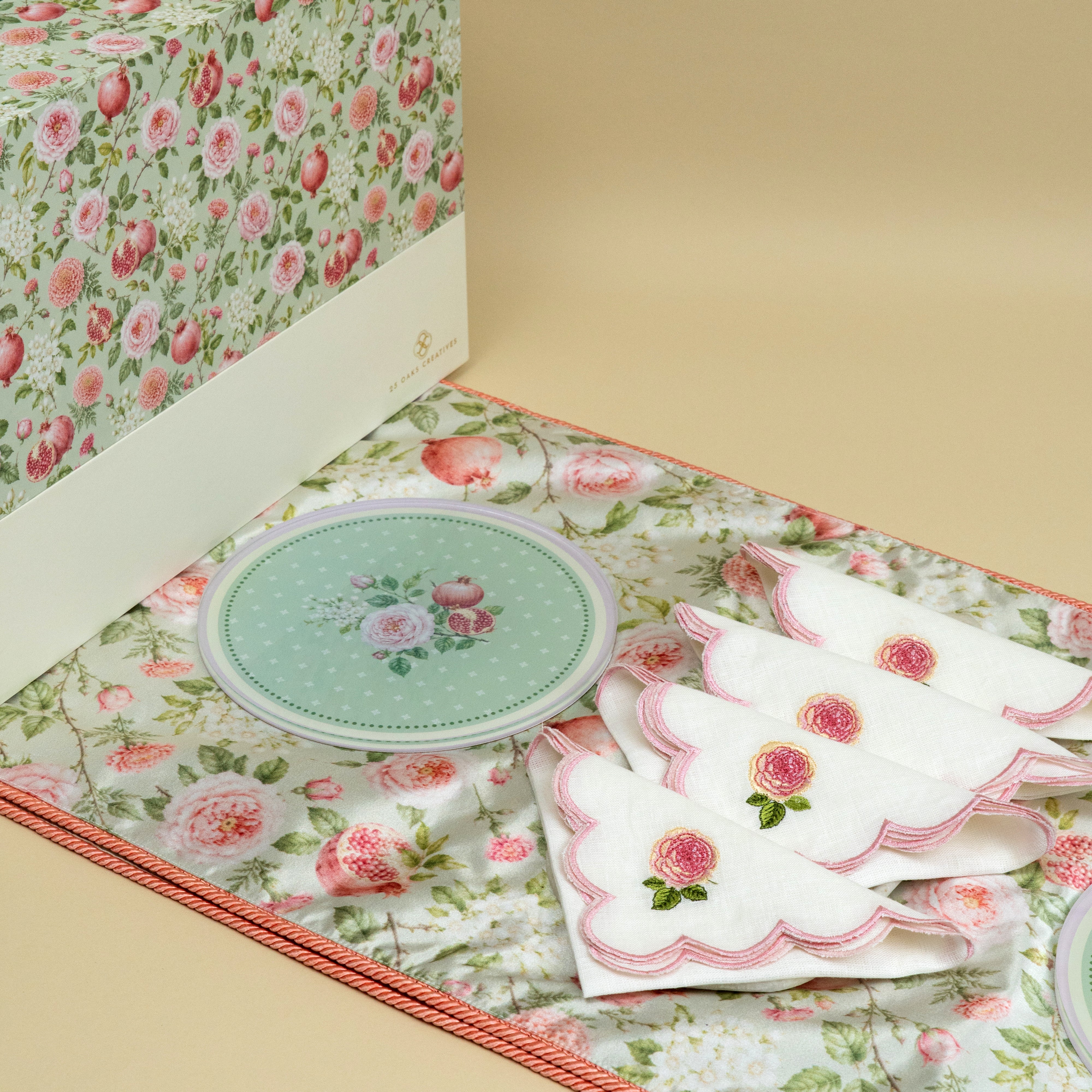 Elegant floral table setting with pink and sage green festive accents