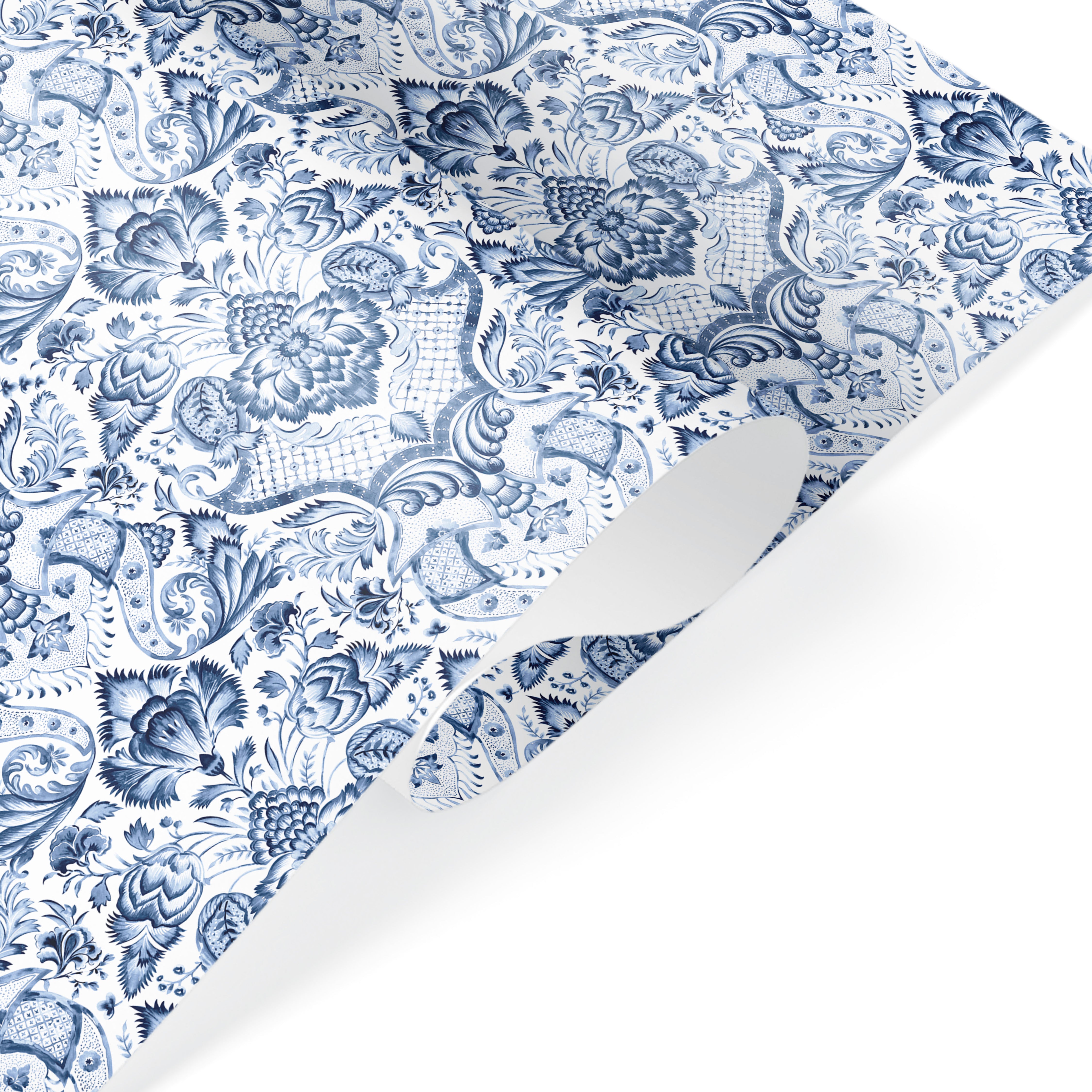 Blue and white floral wrapping paper with intricate batik paisley pattern, festive luxury gift wrap.
