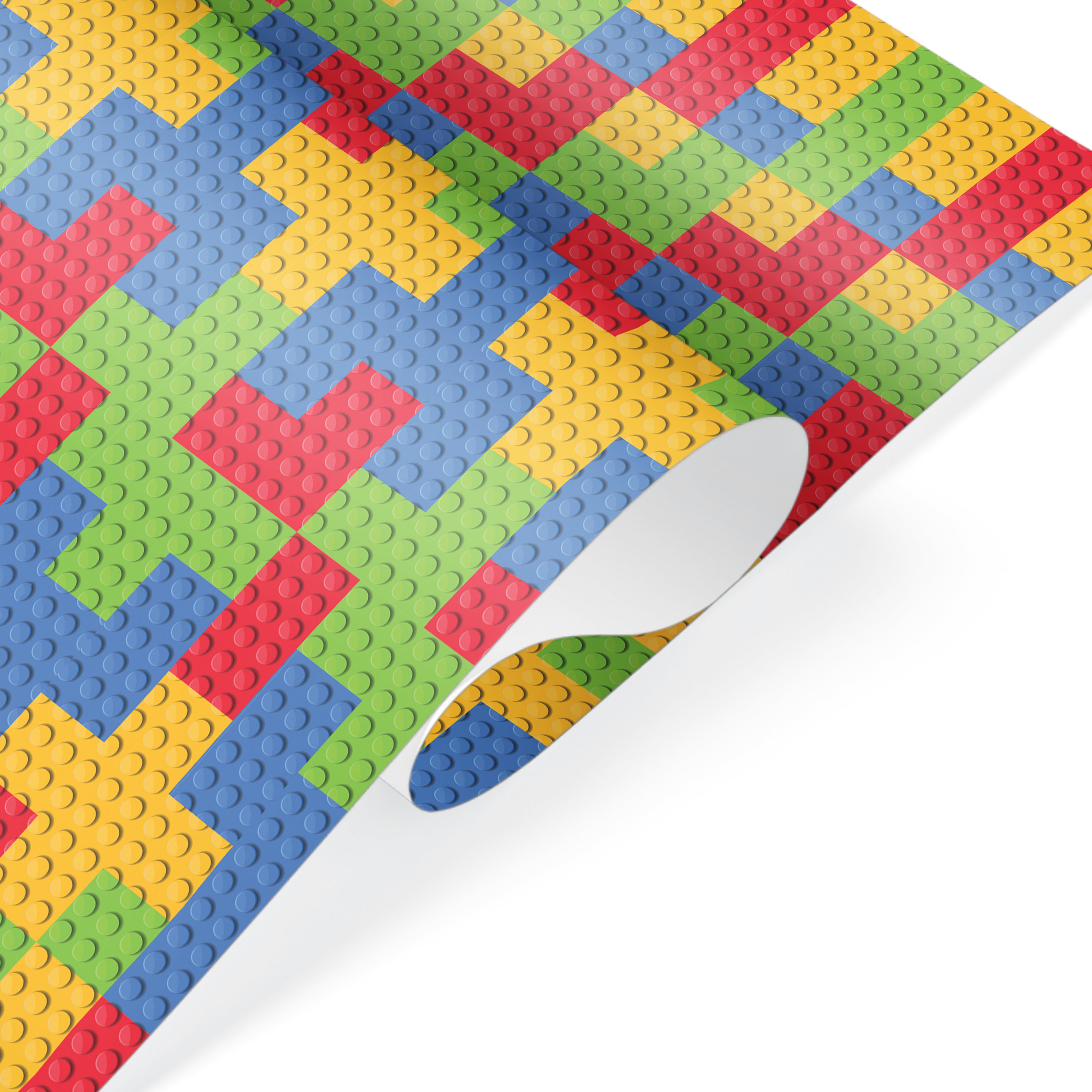 Colorful building blocks wrapping paper with red, blue, green, and yellow pattern, fun kids gift wrap.