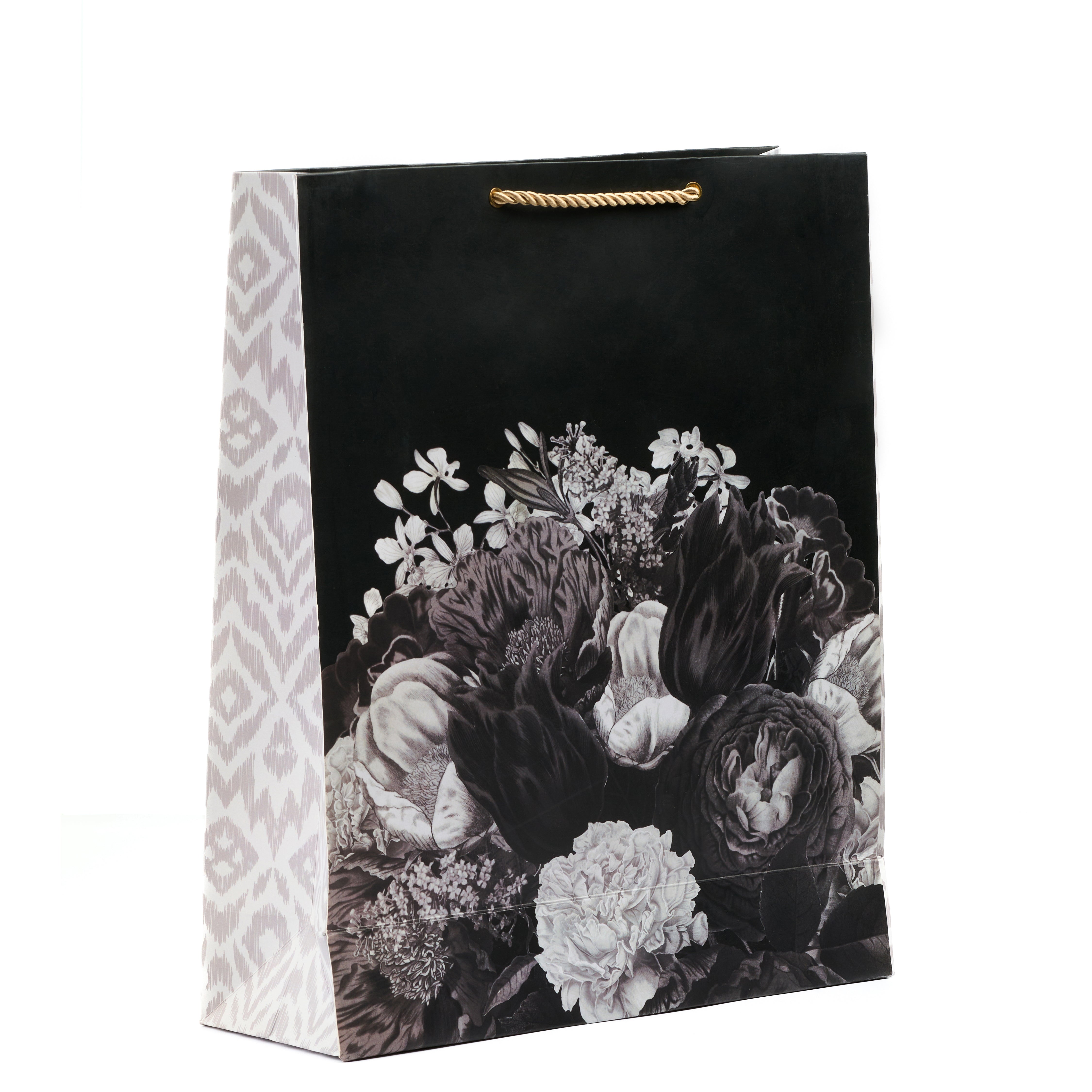 Black floral shirt gift bag with bold monochrome blooms and side ikat pattern, ideal for elegant festive gifting.