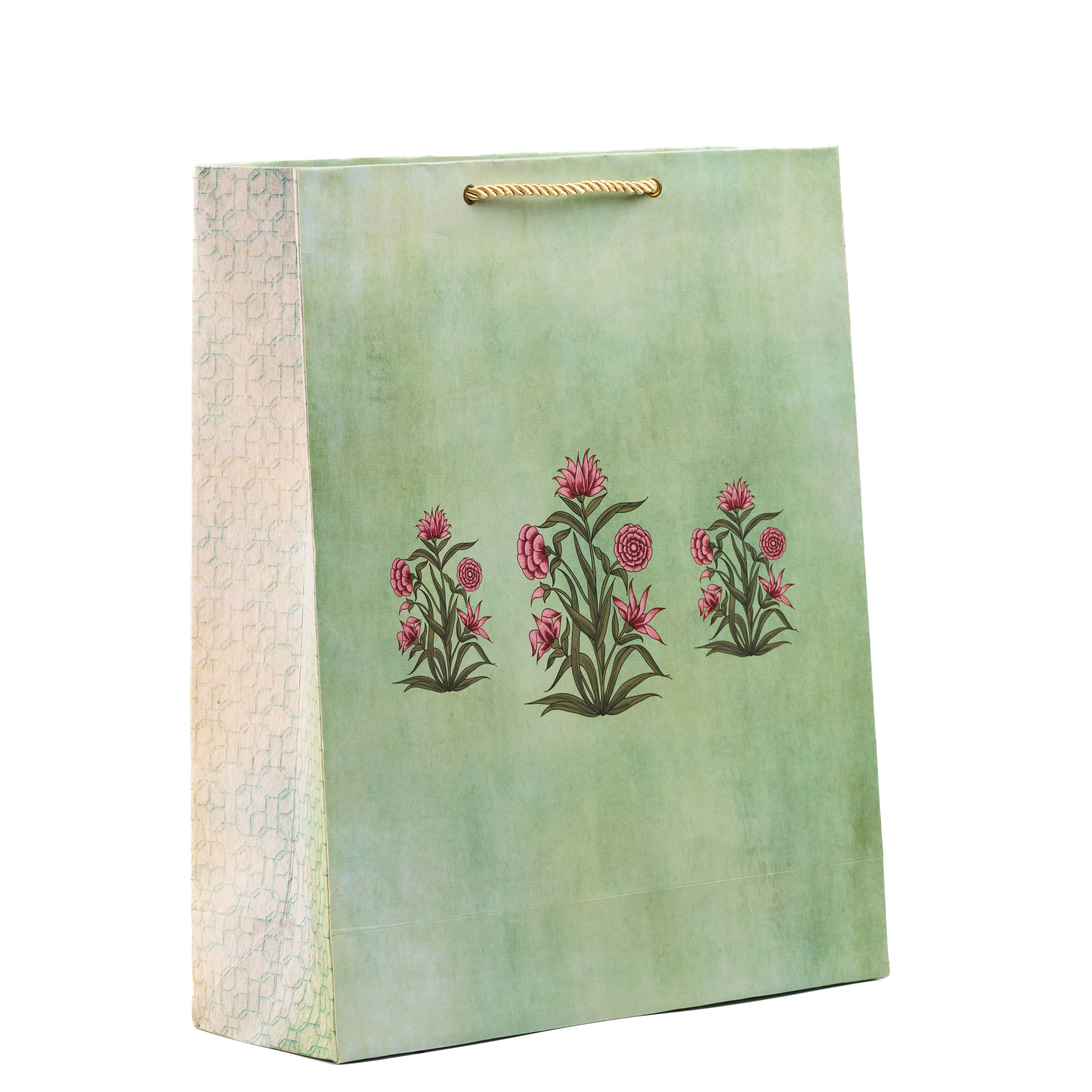 Black floral shirt gift bag with bold monochrome blooms and side ikat pattern, ideal for elegant festive gifting.