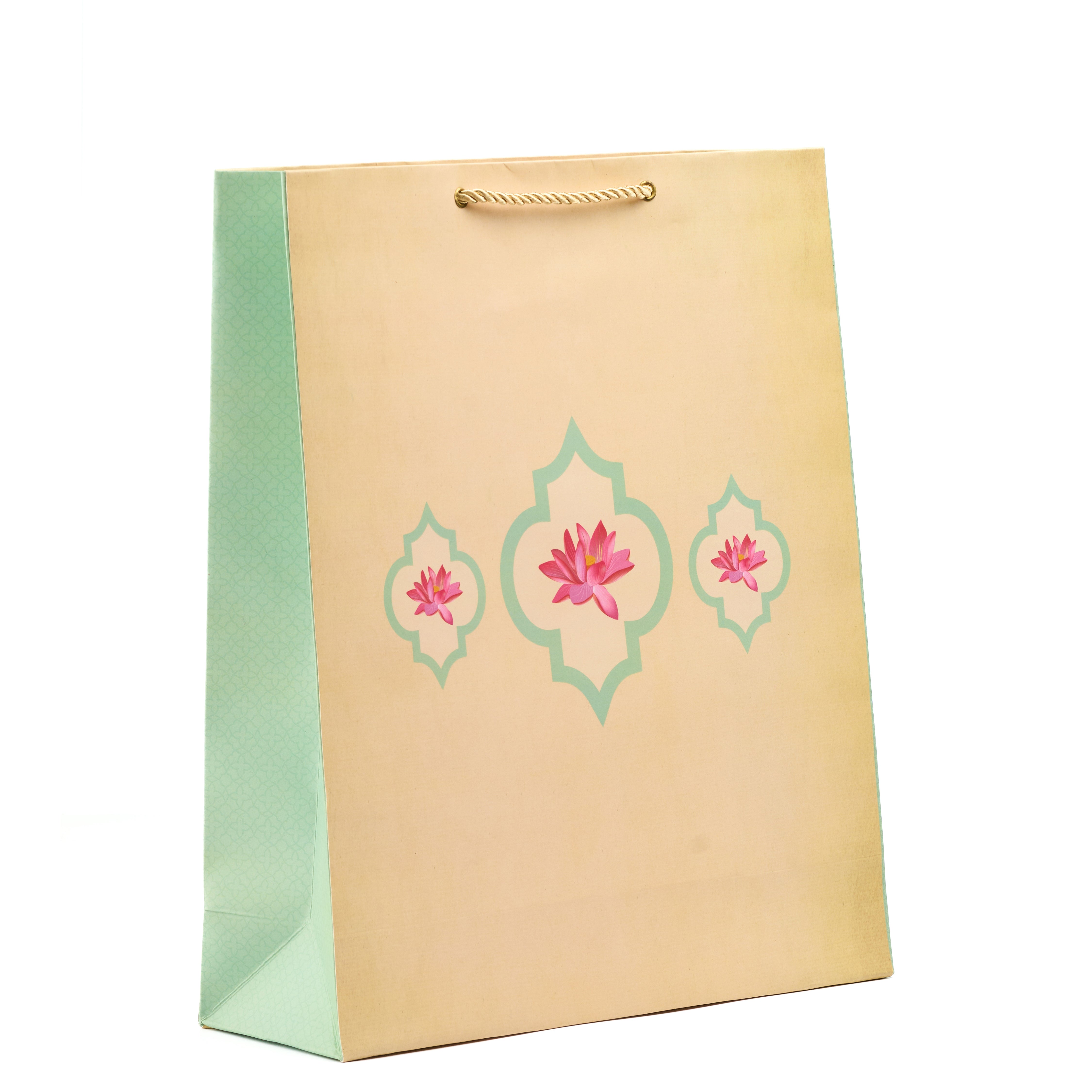 Cream and mint shirt gift bag with lotus motifs and geometric accents, perfect for traditional and spiritual luxe gifting.

