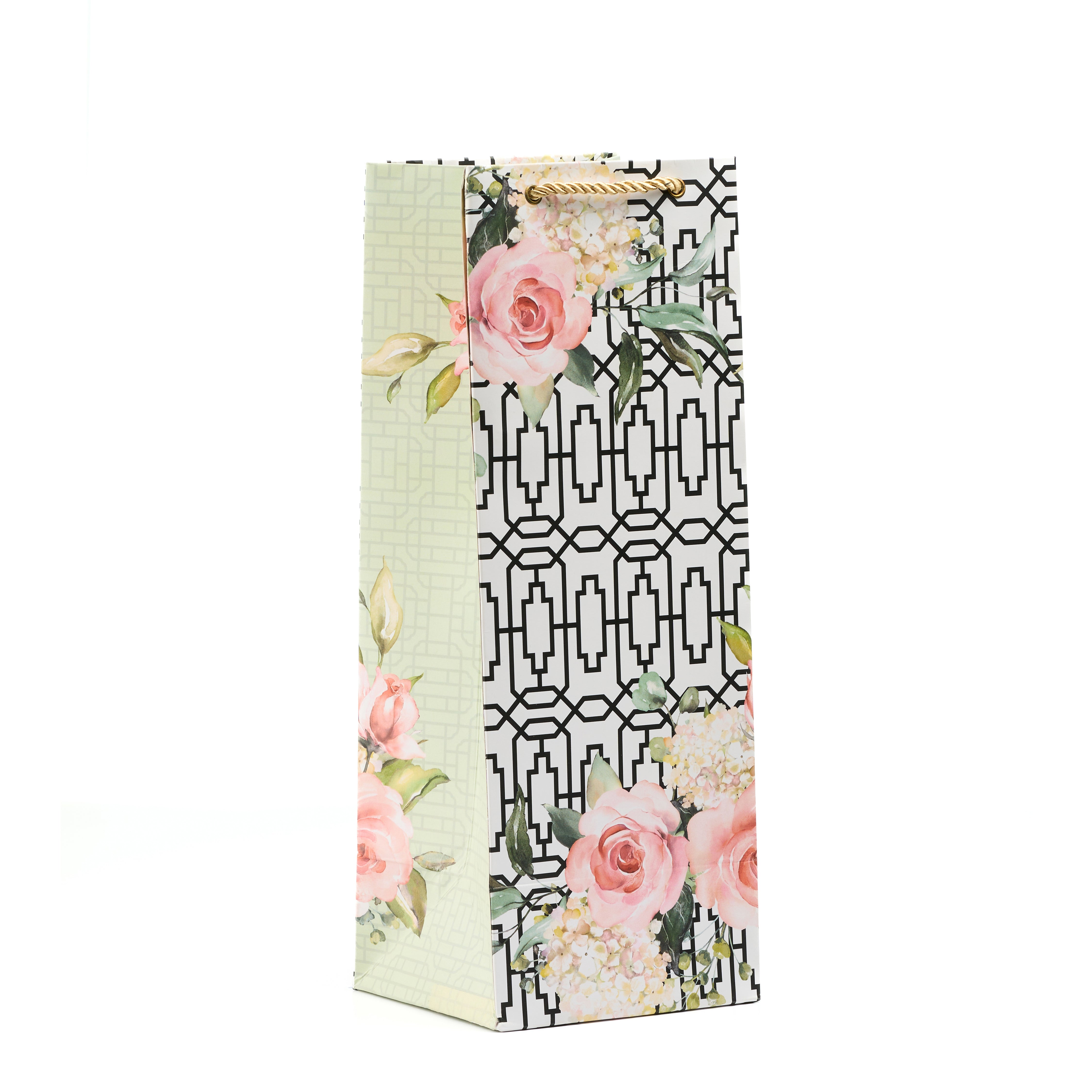 Beige wine gift bag with detailed rose prints and golden rope, ideal for elegant bottle gifting.