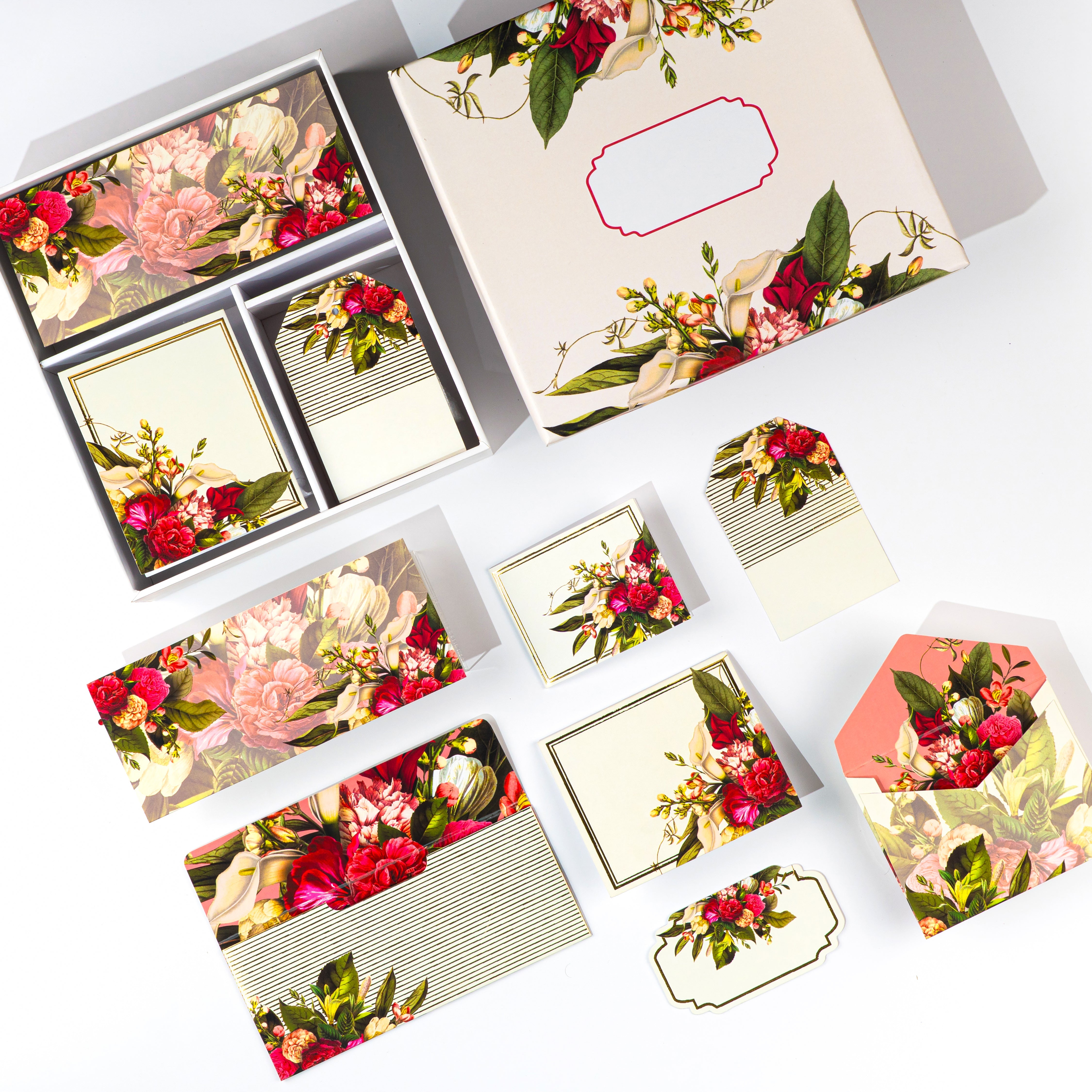 Floral stationery gift set with red and ivory blooms, includes tags, envelopes, and notecards in a keepsake box.