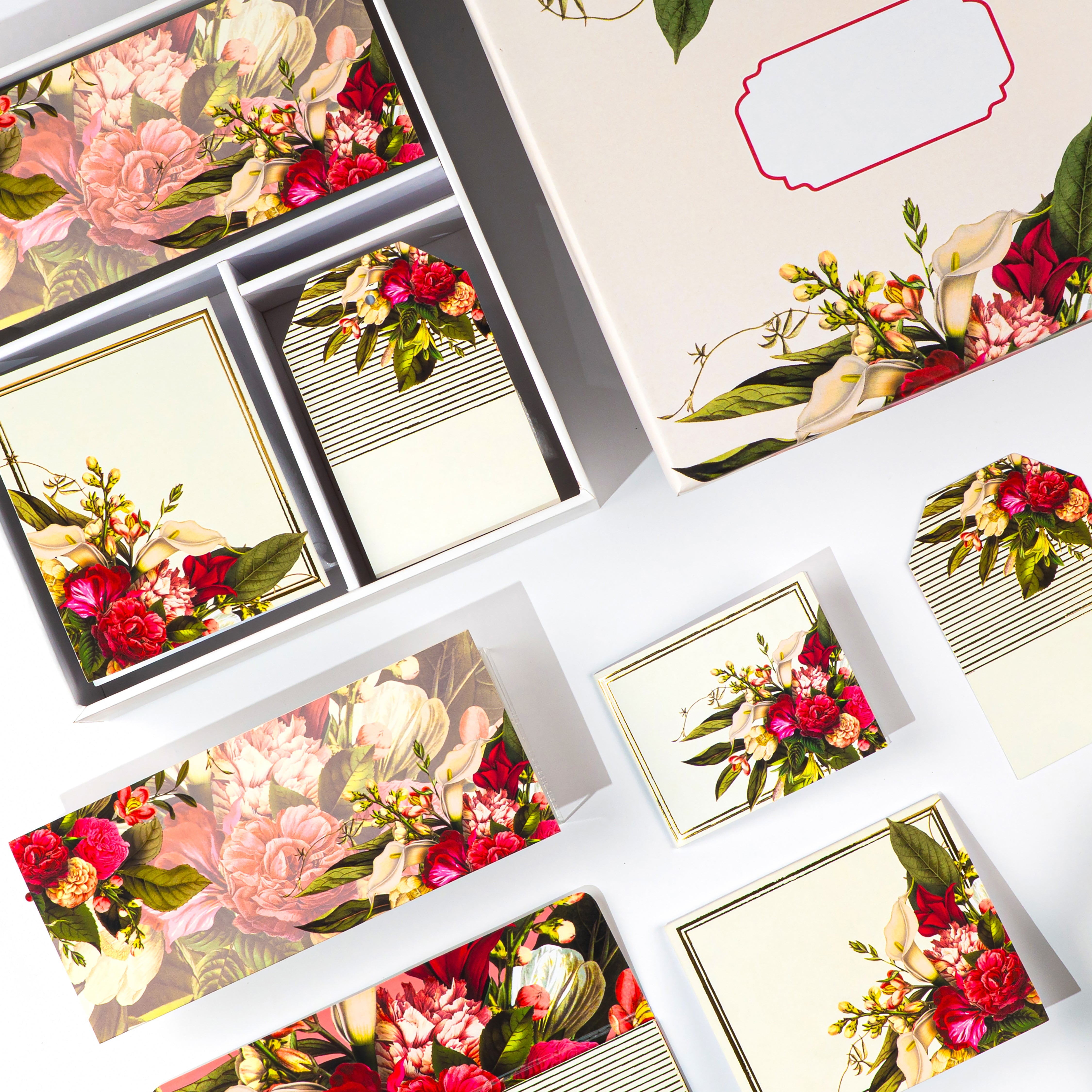 Floral stationery gift set with red and ivory blooms, includes tags, envelopes, and notecards in a keepsake box.