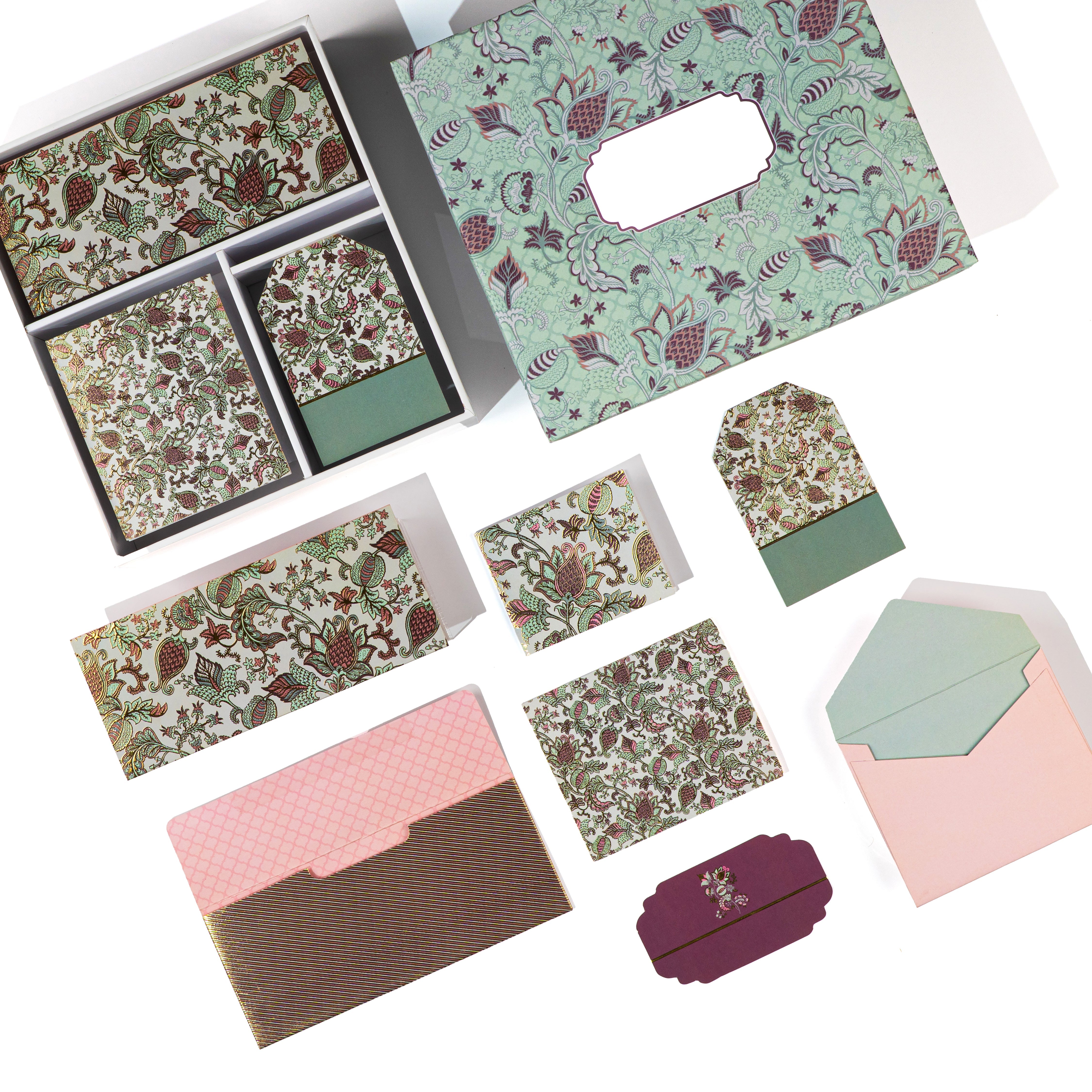 Mint‑green paisley stationery set with botanical prints and coordinating envelopes and gift tags.