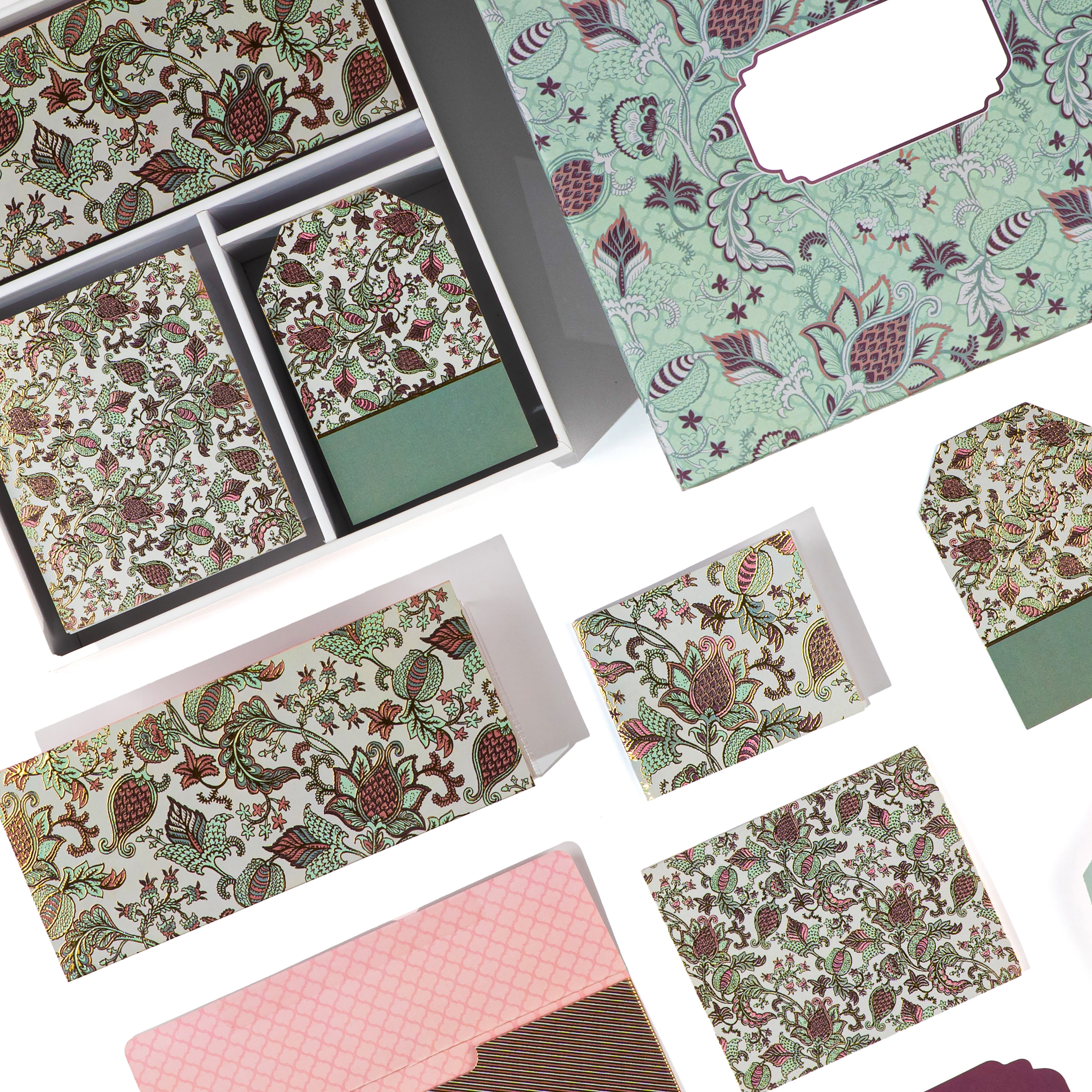 Mint‑green paisley stationery set with botanical prints and coordinating envelopes and gift tags.