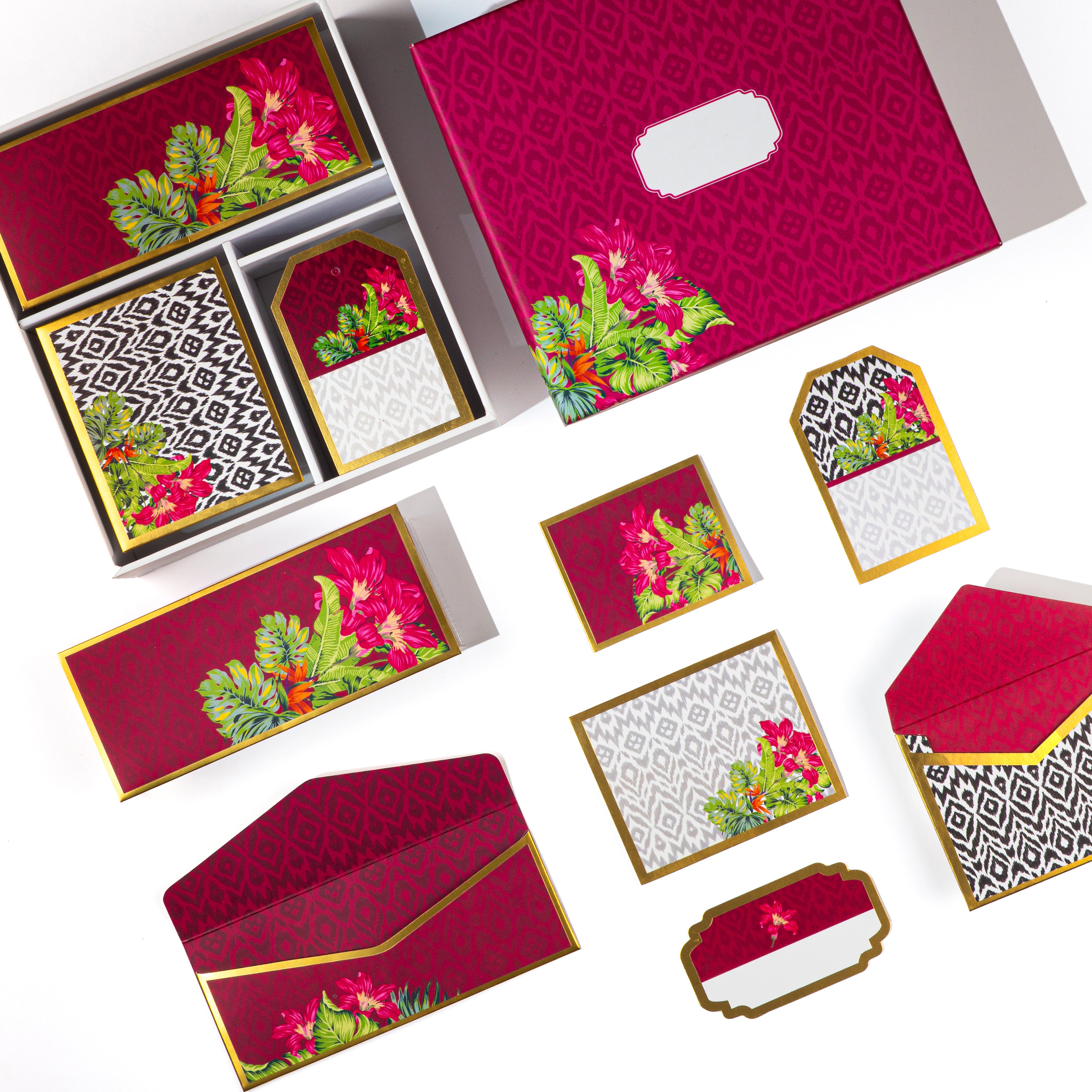 Bright fuchsia stationery with tropical floral and ikat print details in a boxed set.