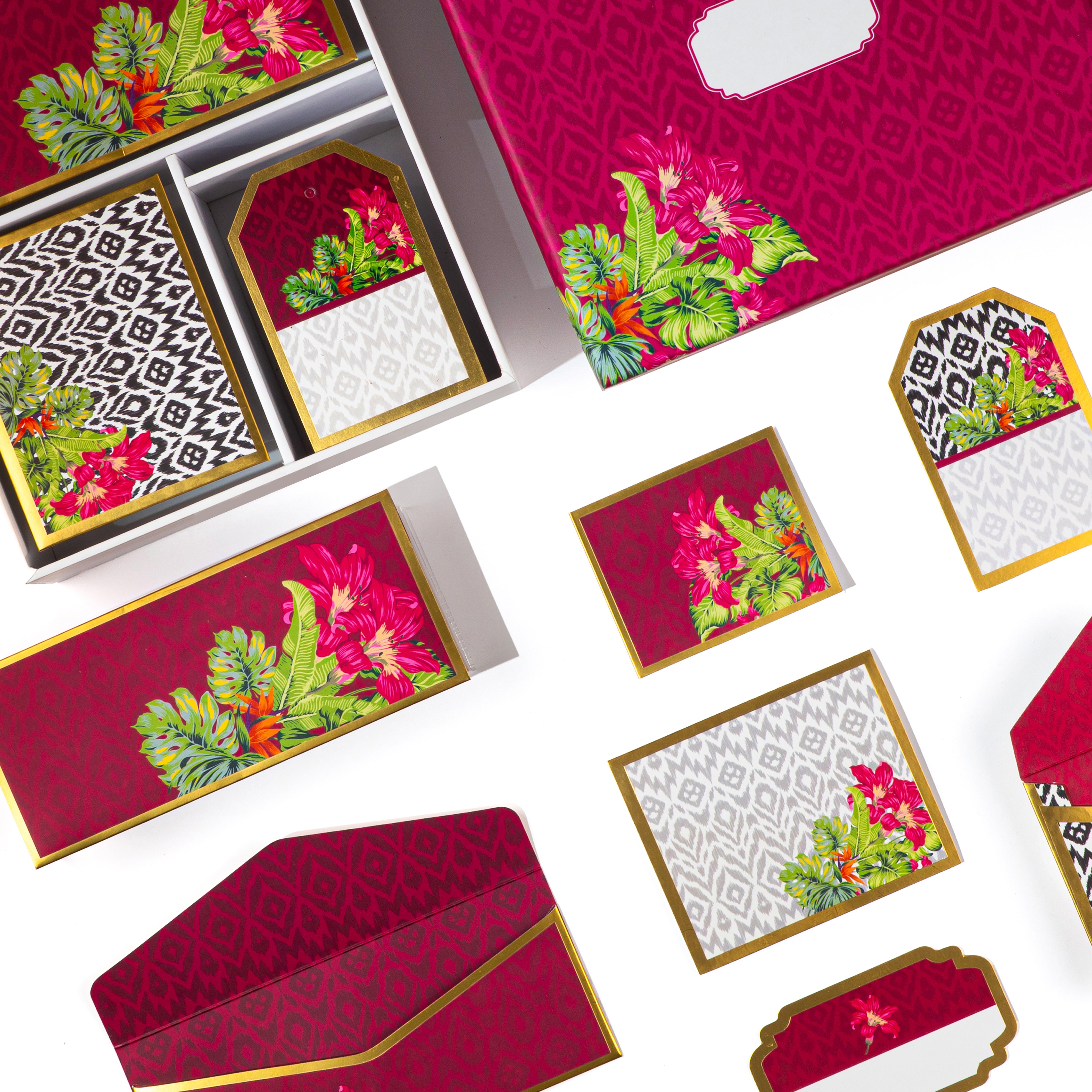 Bright fuchsia stationery with tropical floral and ikat print details in a boxed set.
