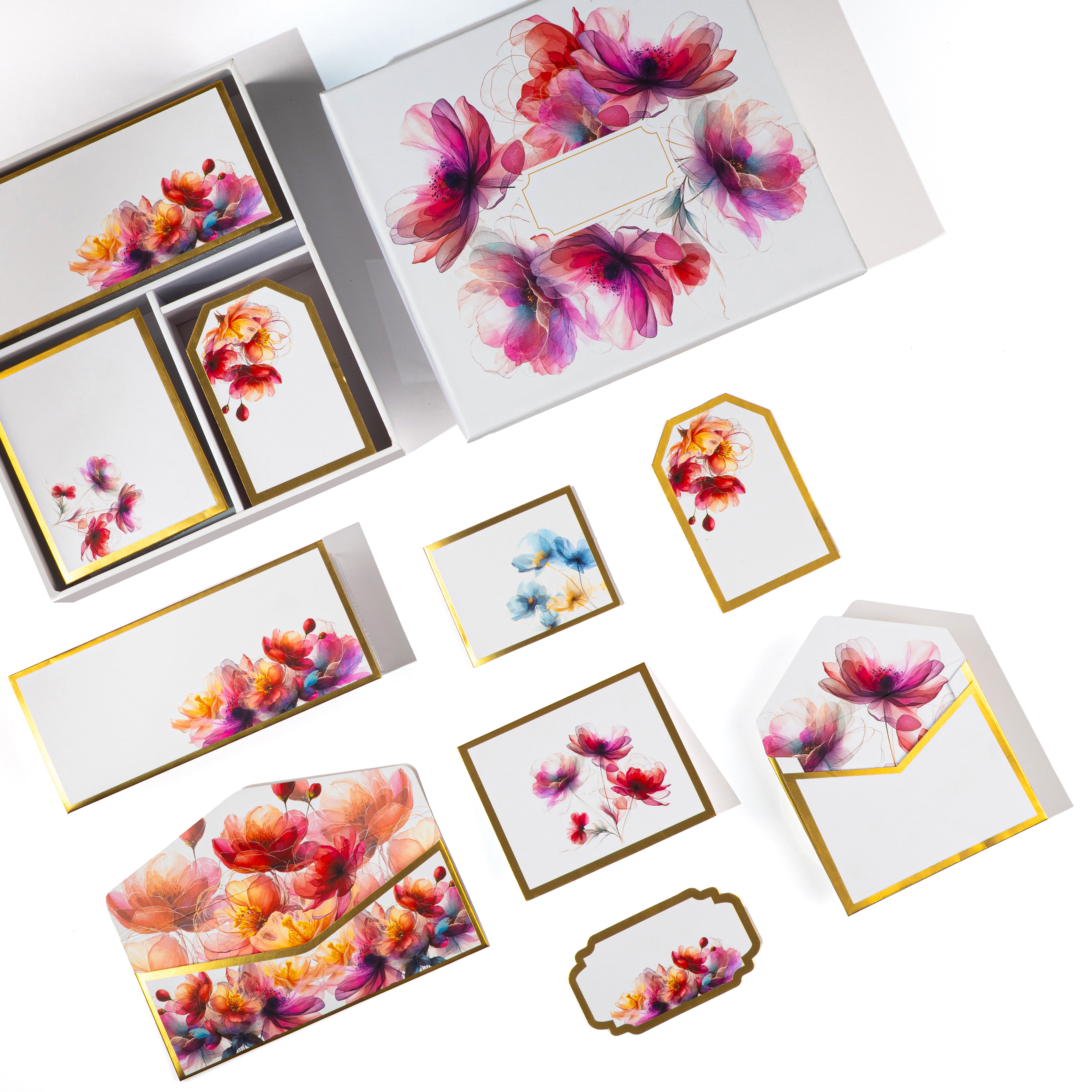 Elegant floral stationery set with watercolor pink and purple blooms, includes cards, tags, and envelopes in a gift box.