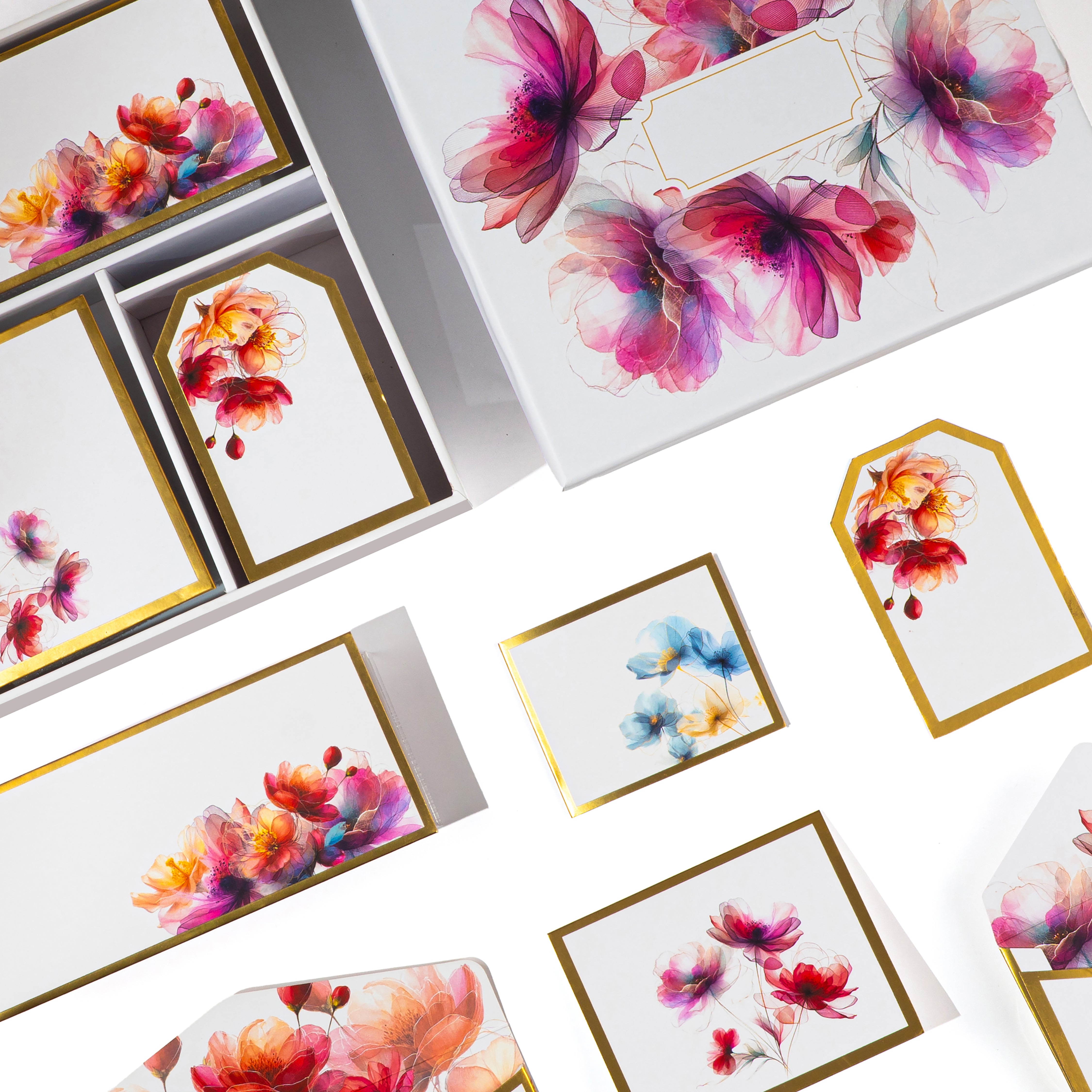 Elegant floral stationery set with watercolor pink and purple blooms, includes cards, tags, and envelopes in a gift box.