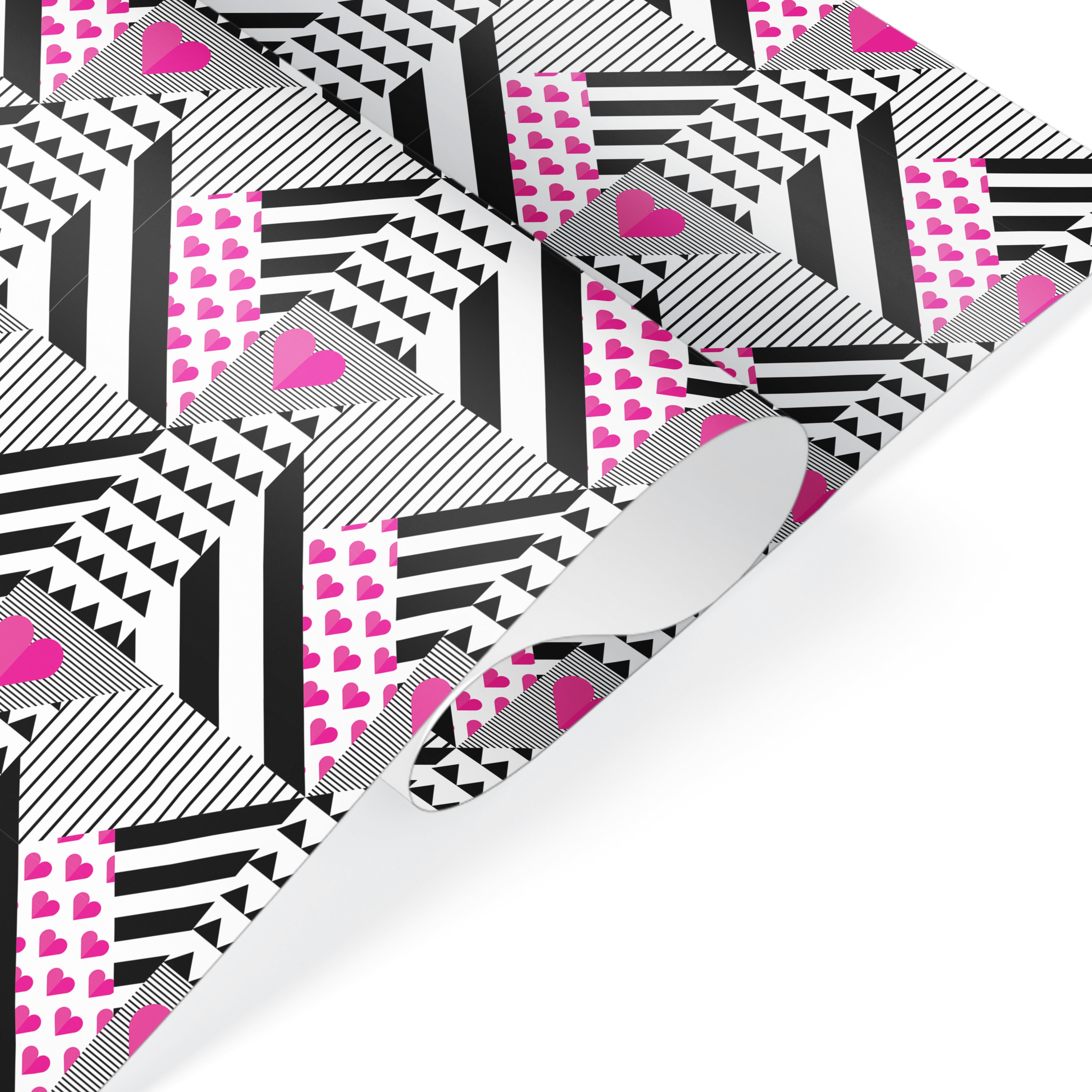 Black and white geometric wrapping paper with pink hearts, modern graphic gift wrap for celebrations.
