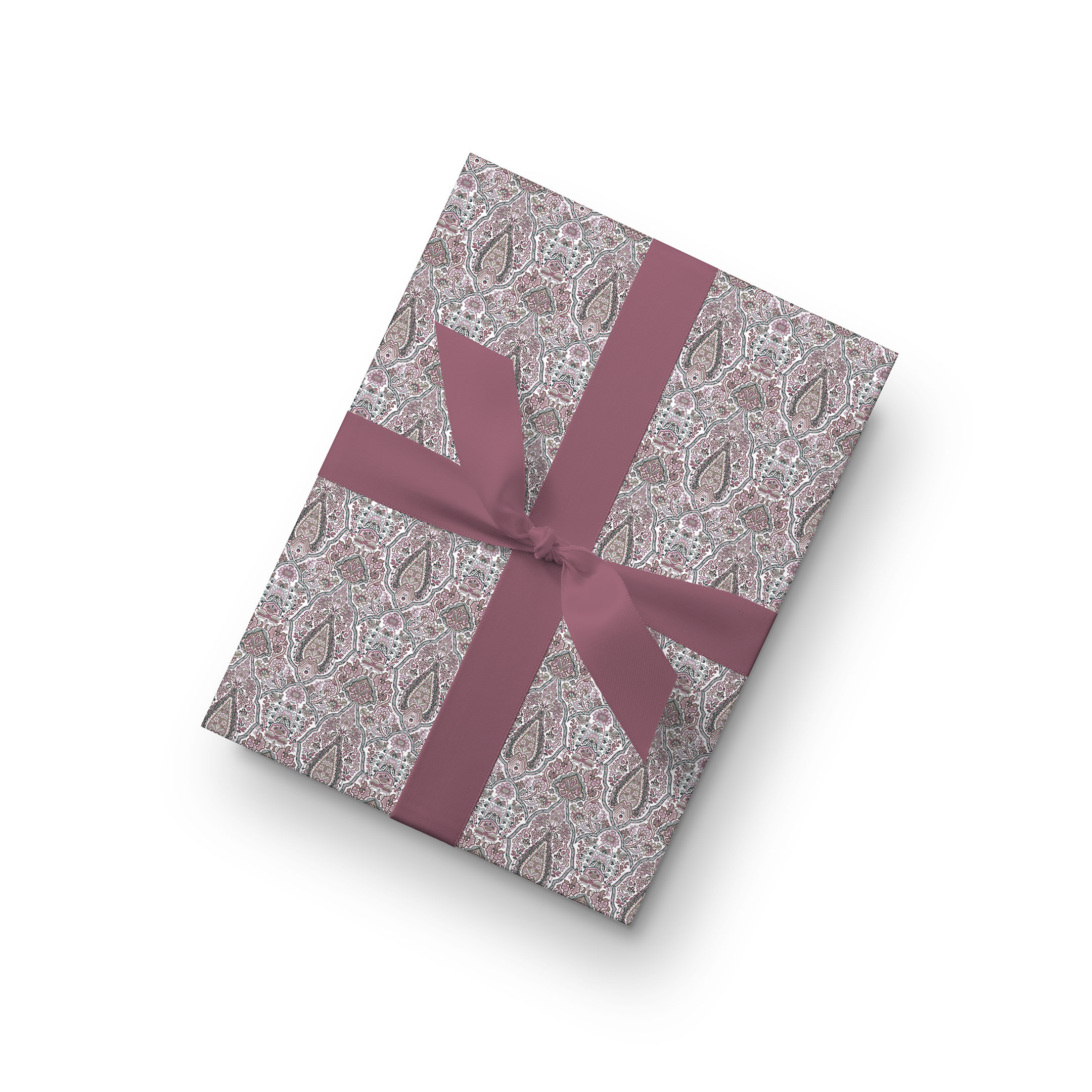 Luxury jamewar print wrapping paper in blush tones with a satin ribbon, featuring intricate paisley patterns.