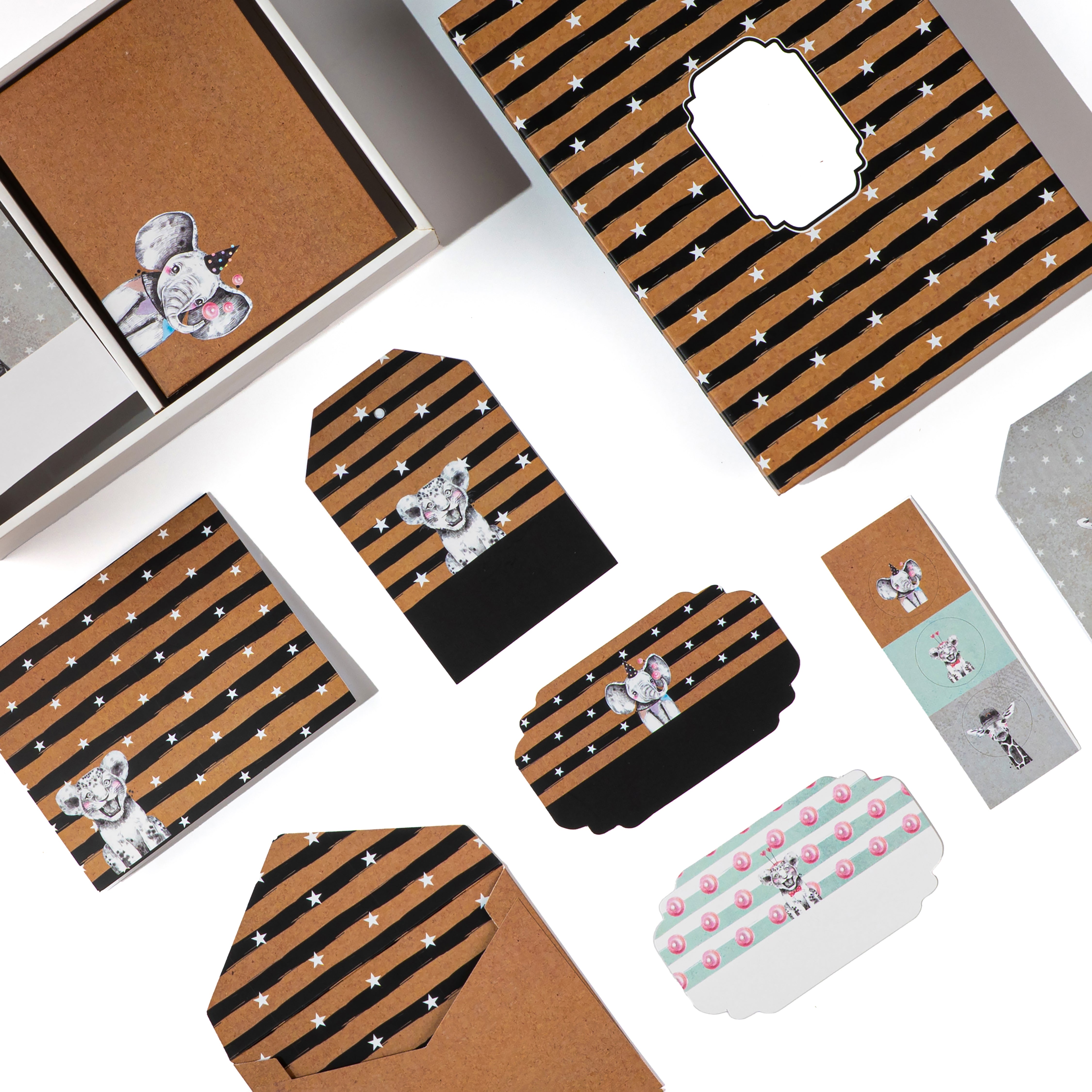 Kraft paper set with zebra‑striped envelopes and whimsical animal face prints.