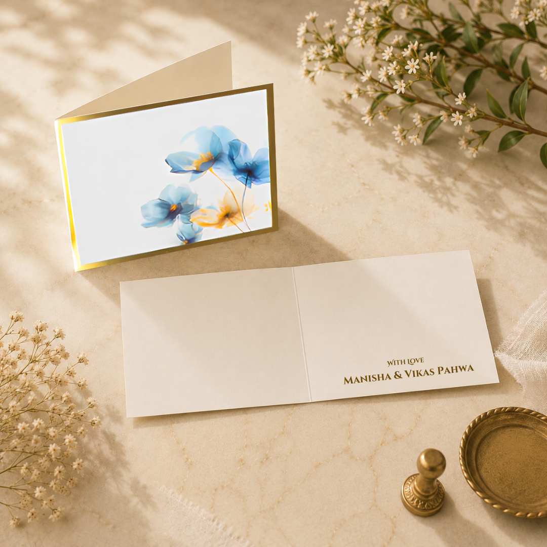 Elegant Petal Mist folded card with soft blue floral artwork and gold border styling on a neutral luxury background
