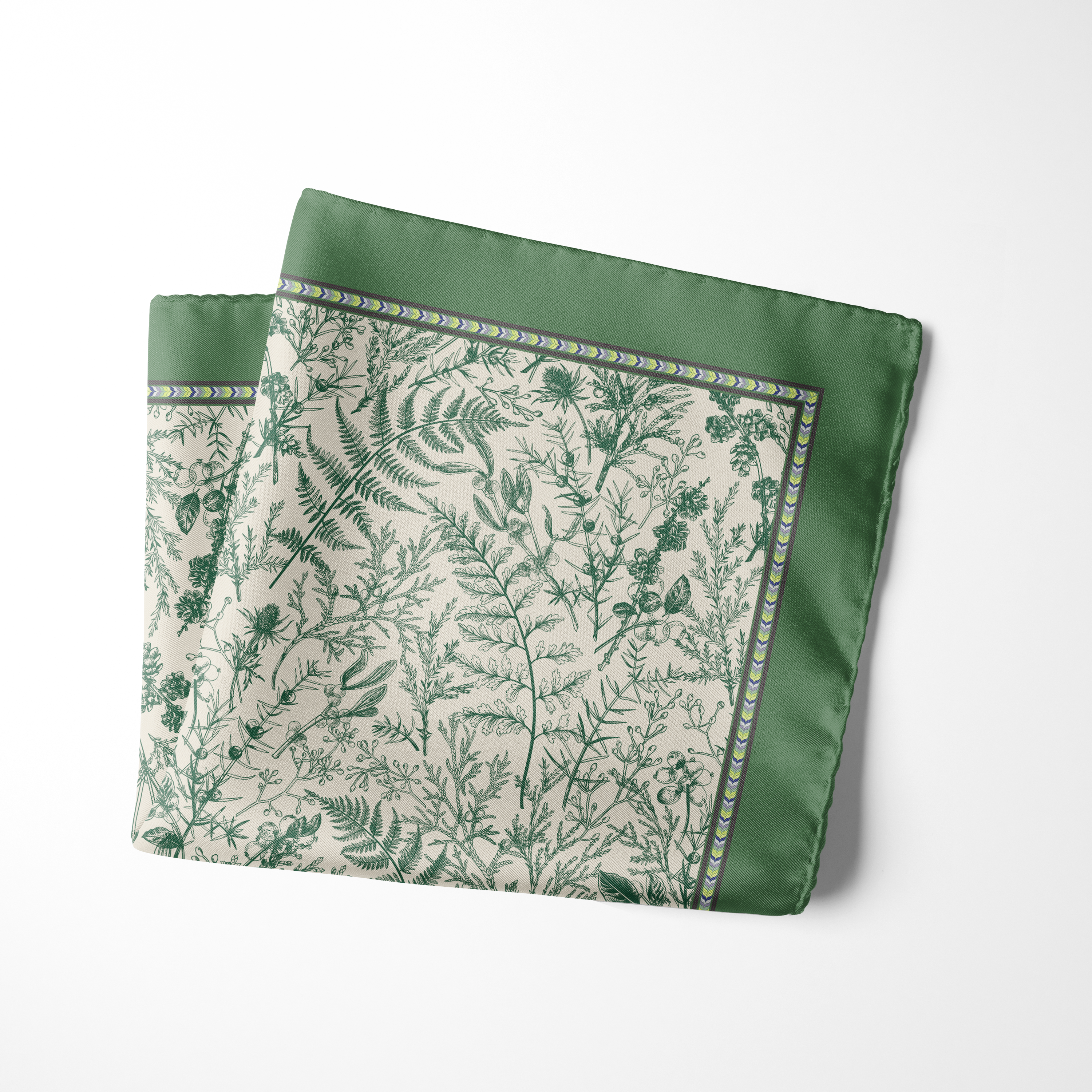 Deep green pocket square with intricate botanical foliage motifs on an ivory centre