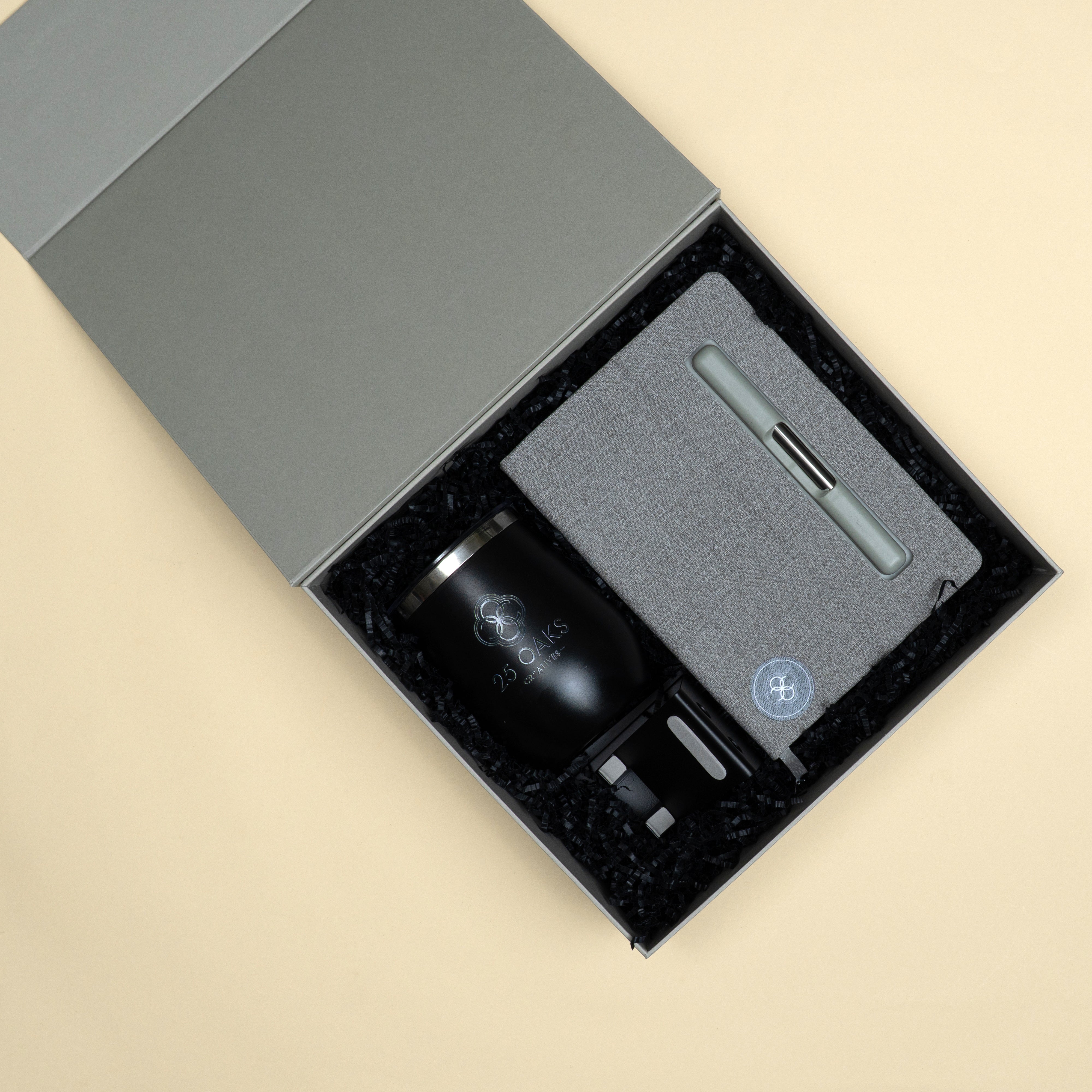 The Morning Routine corporate gift set with grey diary, black metallic pen, pen stand with card holder and insulated mug.